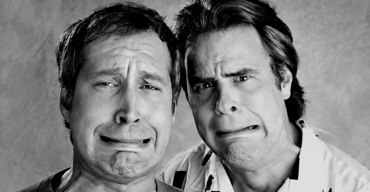 Chevy Chase and Dan Aykroyd comically grimace at the camera in Los Angeles in February of 1986