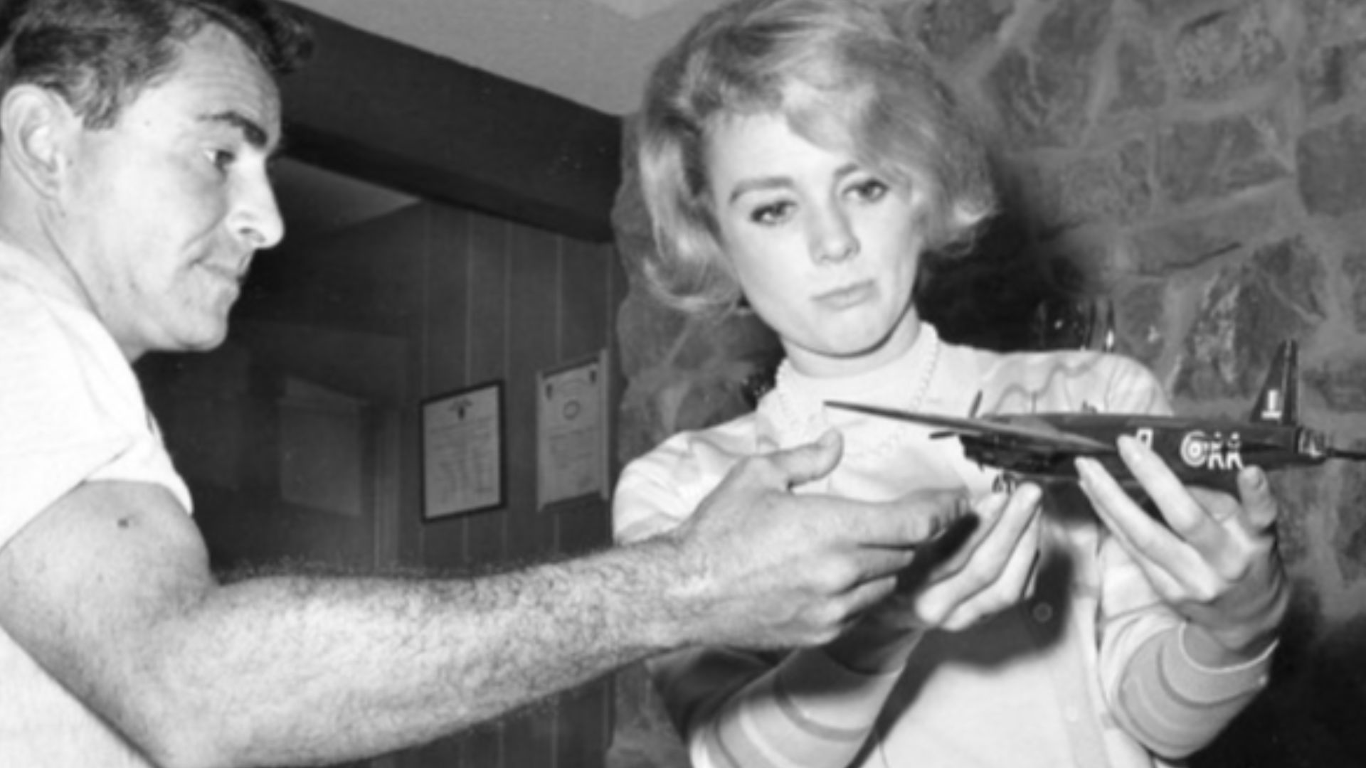 Photo of Rod Serling and actress Inger Stevens with Serling's model airplane collection at his home.  Stevens starred in two 'The Twilight Zone episodes
