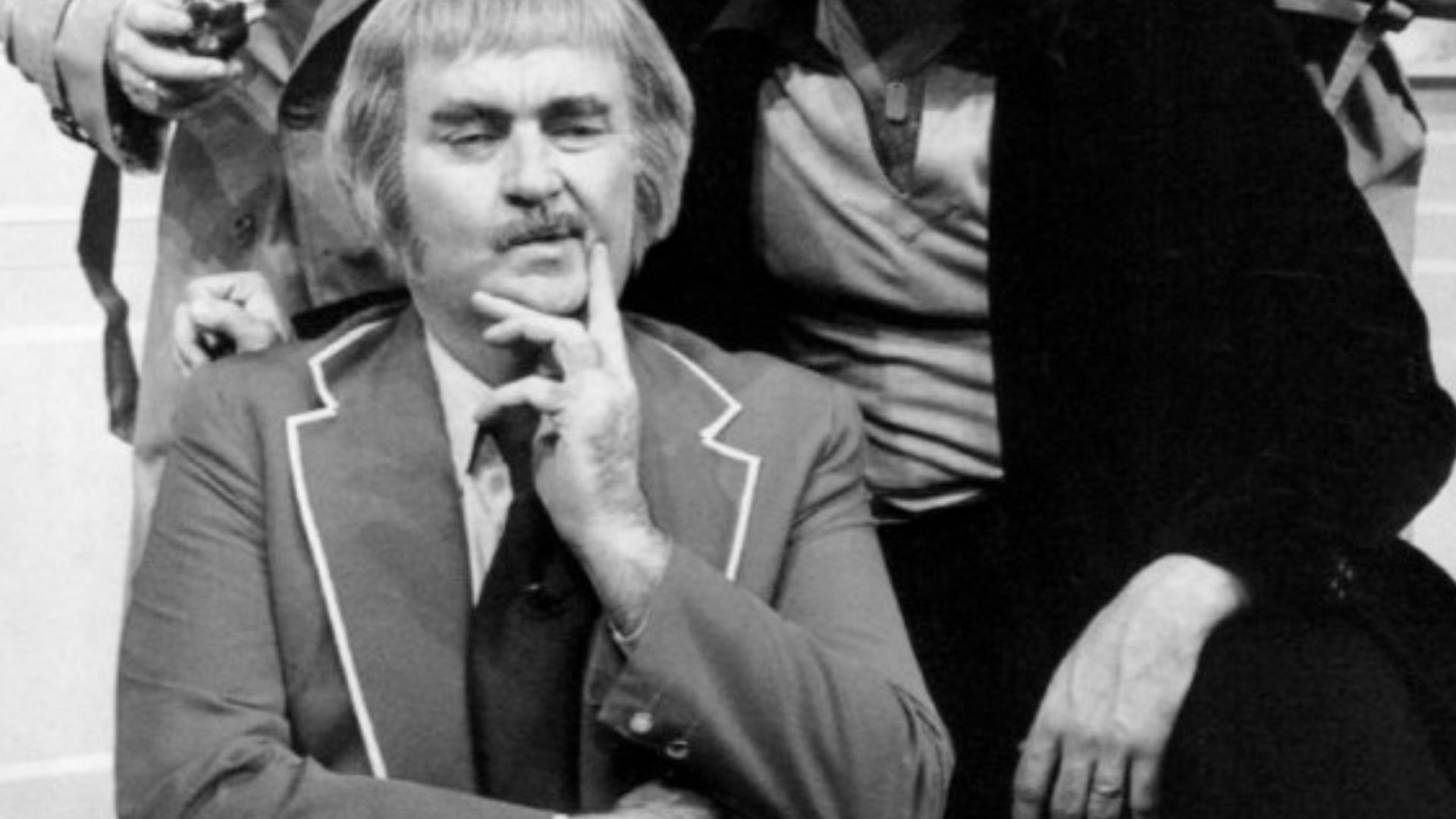 Photo of the musical group the Hudson Brothers and Bob Keeshan as they visit the television program Captain Kangaroo.