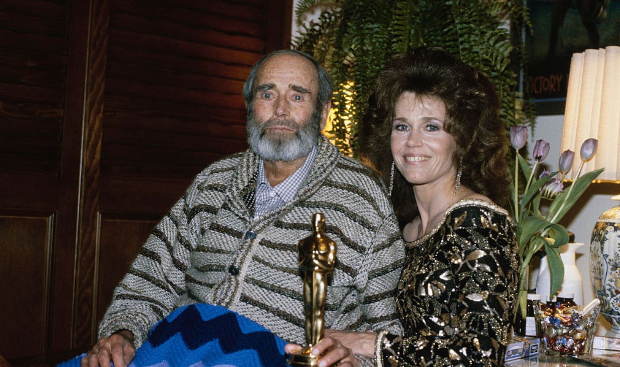 American actress Jane Fonda presenting her father Henry Fonda (1905 - 1982) with an Oscar statuette at his home in Los Angeles, California, March 29th 1982. Fonda had picked up the trophy on her father's behalf. He won the Best Actor Academy Award for his performance in 'On Golden Pond'.