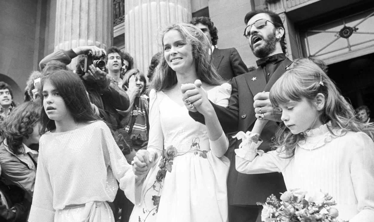Ringo Starr, 41, leaves Marylebone Registry Office with his new wife Barbara Bach, 30. The former Beatle and the actress met on the set of the film Caveman. The bridesmaids were Bach's daughter Francesca Gregorini (left) and Starr's daughter Lee Starkey (right).
