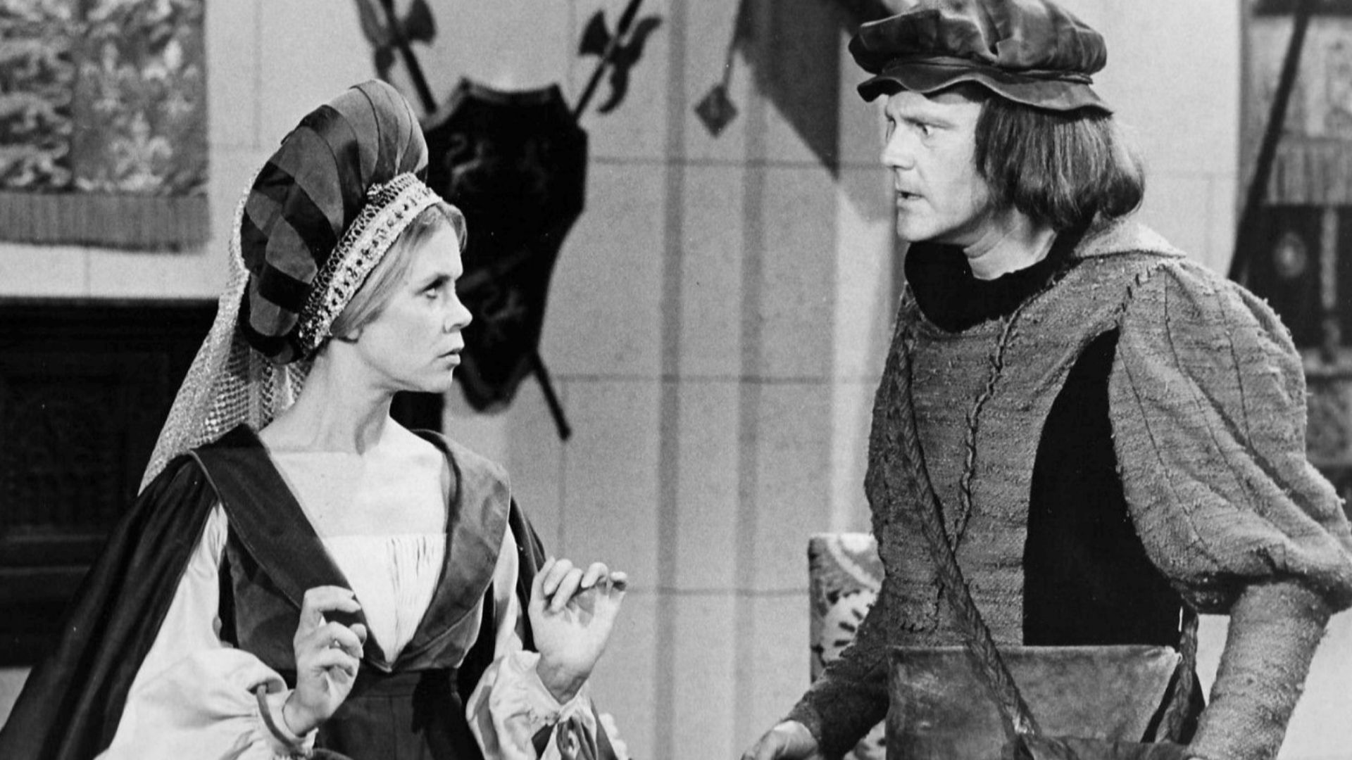 Photo of Elizabeth Montgomery and Dick Sargent from the television program Bewitched.  In this episode, Samantha gets sent back in time to the era of Henry VIII, where she is a minstrel in a traveling show, and also in danger of becoming one of Henry's wi