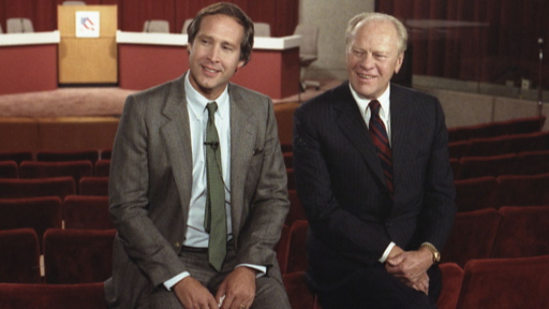 Gerald Ford and Chevy Chase sit before the Conference on Humor and the Presidency held at the Gerald R. Ford Museum in 1986