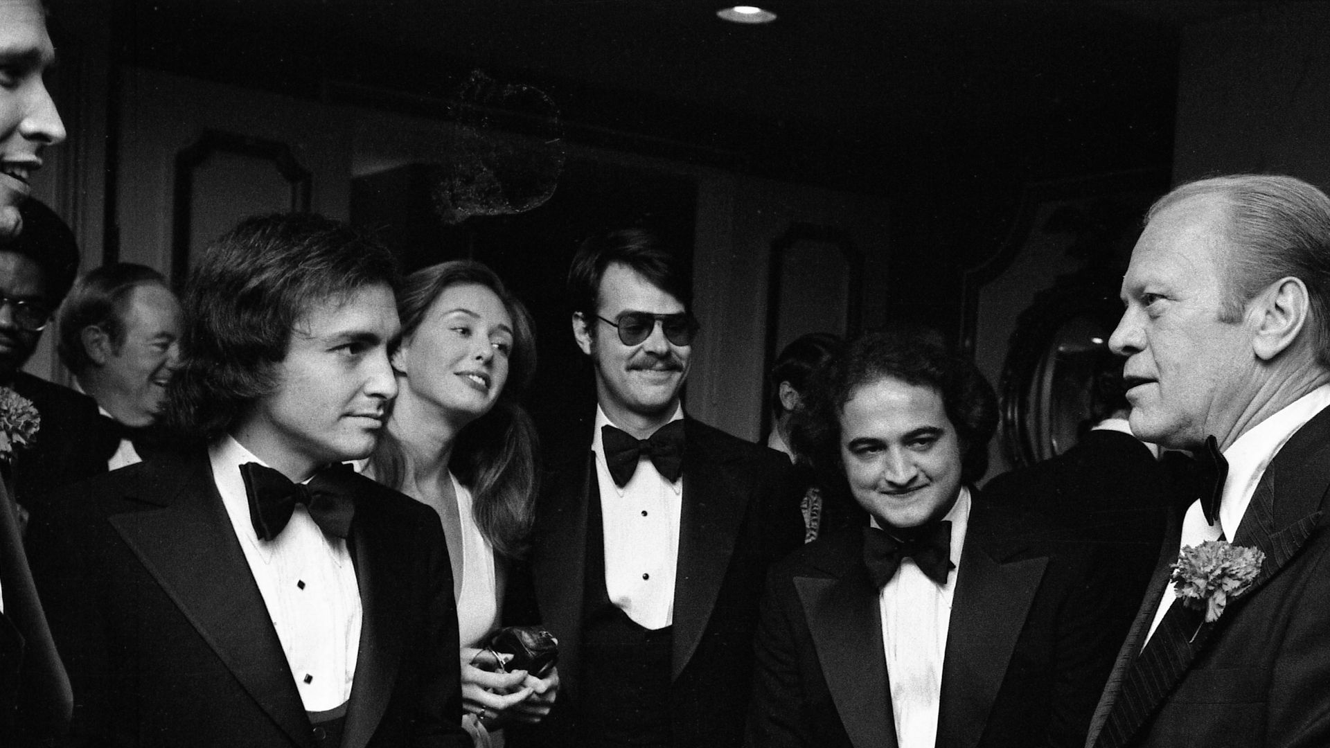 File:President Gerald R. Ford Talking with Chevy Chase, Saturday Night Live Producer Lorne Michaels, John Belushi, Dan Aykroyd, and Others at the 32nd Annual Radio and Television Correspondents Association Dinner - NARA - 30805929.jpg