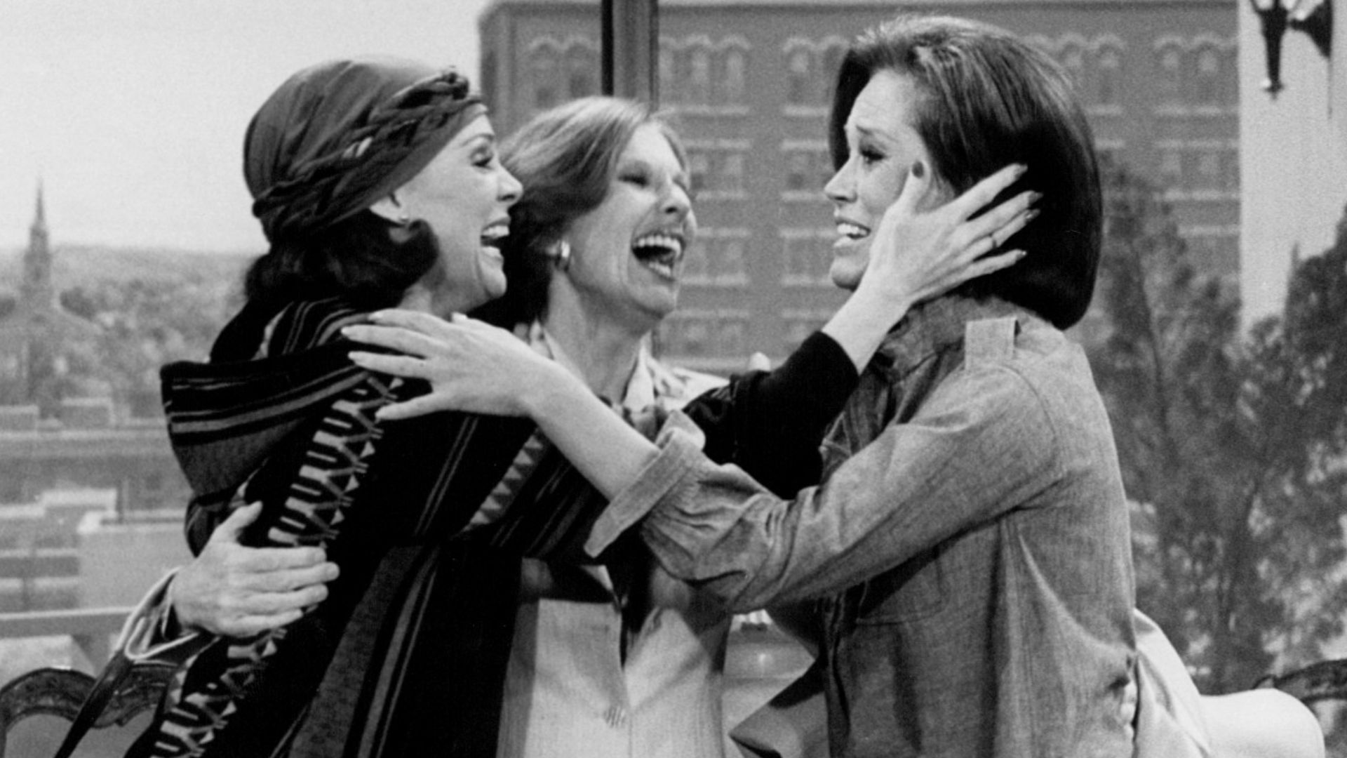 Photo from the last episode of The Mary Tyler Moore Show.  Rhoda Gerard (Valerie Harper, left) and Phyllis Lindstrom (Cloris Leachman, center) come to cheer up Mary Richards (Mary Tyler Moore) after hearing the news that WJM-TV has been sold and that she 