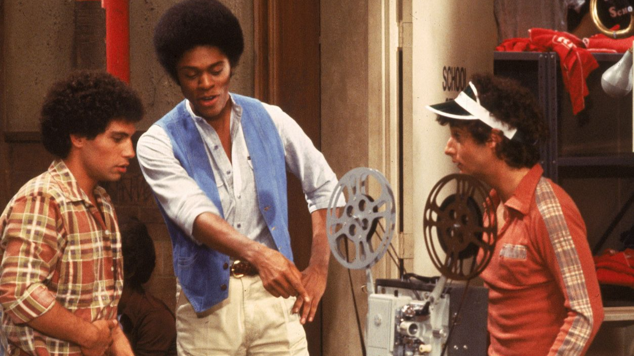 L-R: 'Sweathogs' Robert Hegyes, Lawrence Hilton-Jacobs and Ron Palillo examine a film projector in a still from the television series, 'Welcome Back Kotter,' circa 1977.