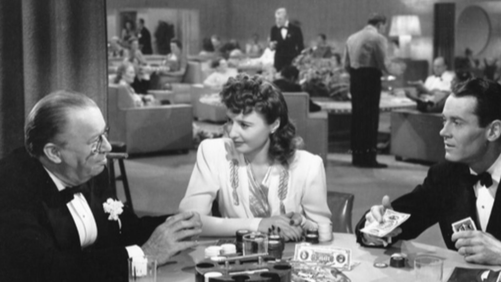 Promotional still from the 1941 film The Lady Eve, published in National Board of Review Magazine. L-R: Charles Coburn, Barbara Stanwyck, Henry Fonda
