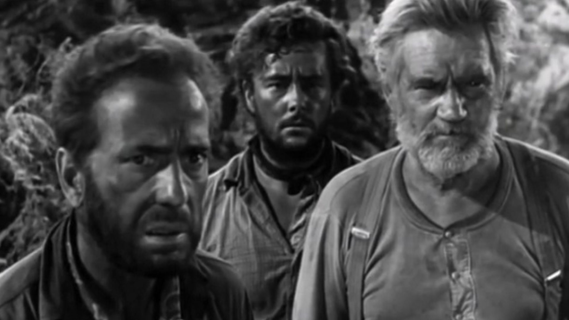 Cropped screenshot of Humphrey Bogart, Tim Holt and Walter Huston from the trailer for the film The Treasure of the Sierra Madre.
