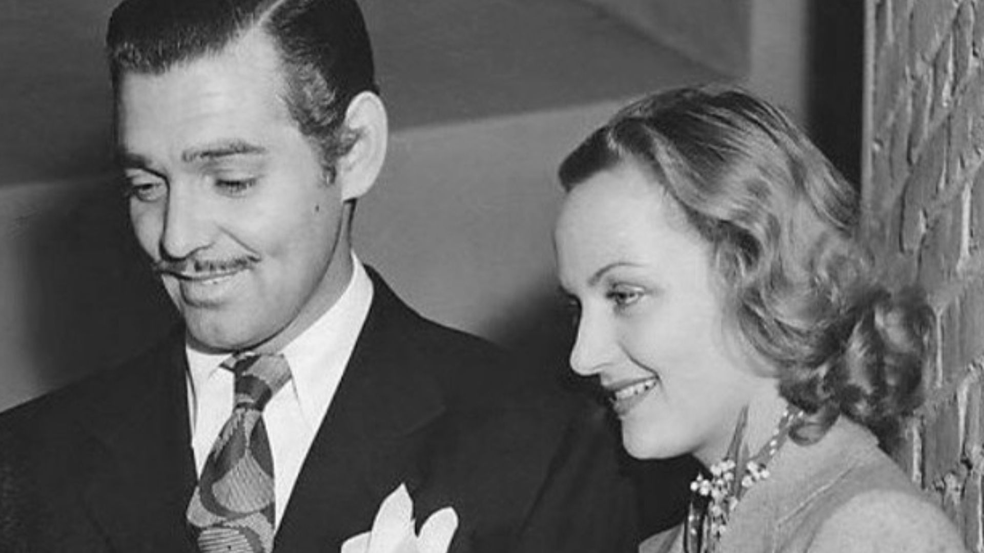 Photo of Clark Gable, Carole Lombard and Mrs. Elizabeth Peters, the mother of Carole Lombard.  It was originally taken after Gable and Lombard returned from their elopement to Kingman, Arizona, on March 31, 1939.  The wire service re-issued the photo on J