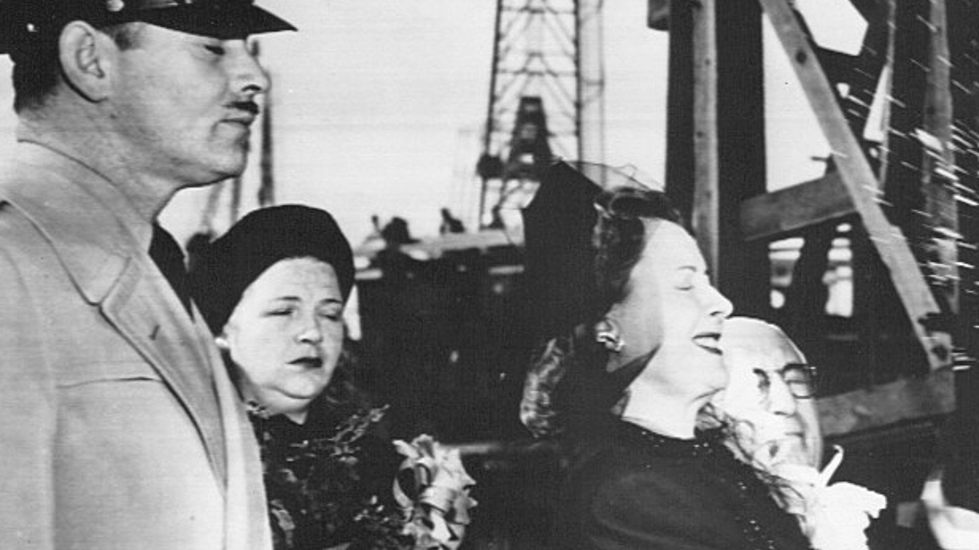 Photo of the christening of the Liberty Ship S. S. Carole Lombard on January 15, 1944; this was one day short of the second anniversary of Lombard's death in a plane crash while on a publicity tour to promote the sale of Liberty Bonds.  At back are Clark 