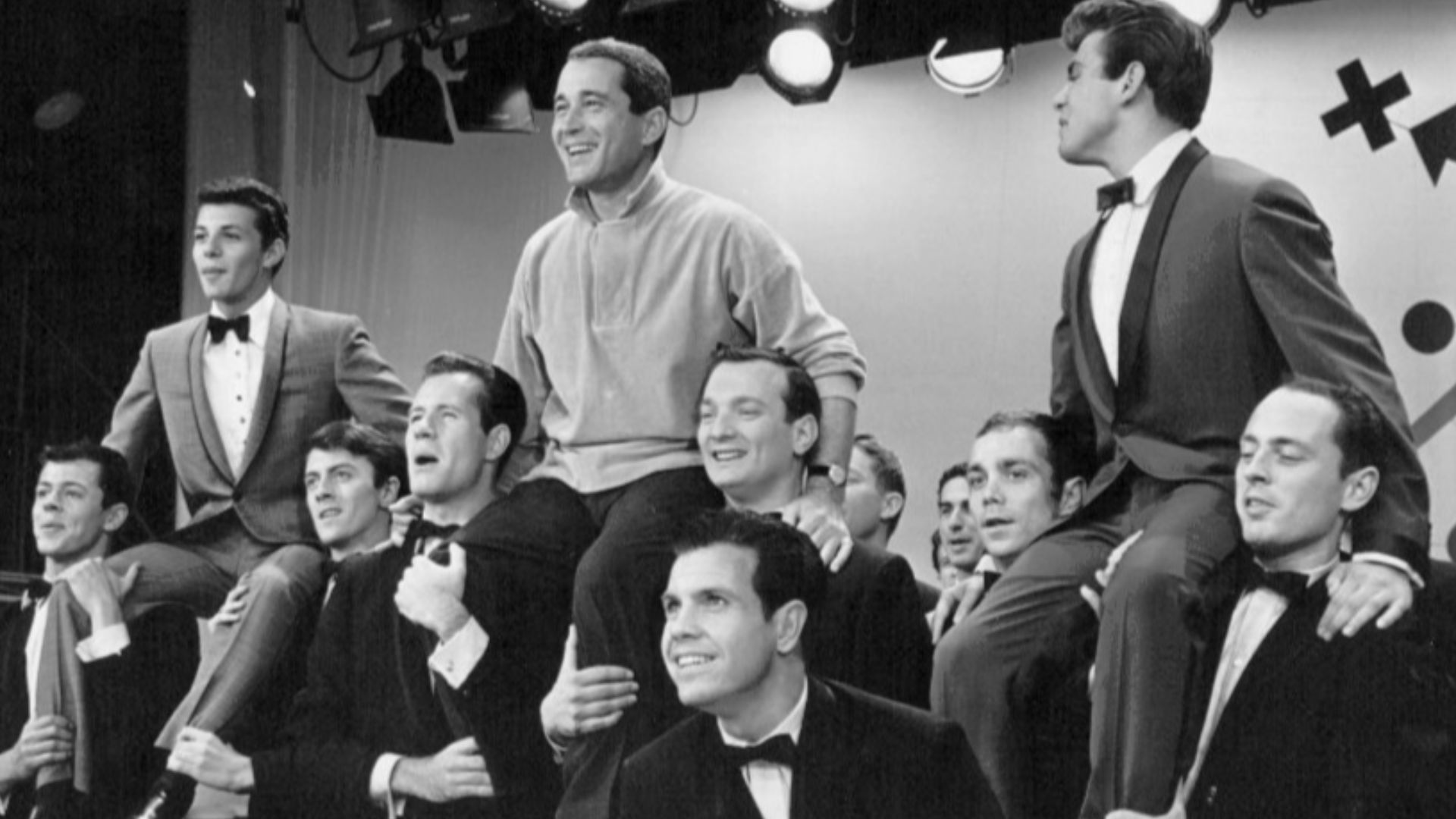 Photo on set from Perry Como's Kraft Music Hall.  From left-Fabian, Perry Como and Frankie Avalon in a production number from the television show.  Fabian and Avalon were Como's guests on the show on October 5, 1960.