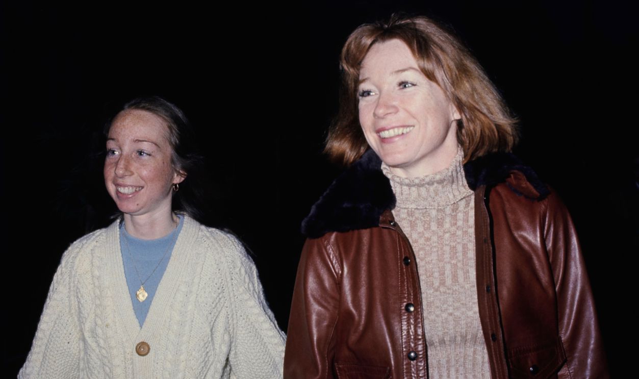 American actress Sachi Parker, wearing a white cable knit cardigan over a blue t-shirt, and her mother, American actress Shirley MacLaine, who wears a brown leather jacket with a black fur collar over a beige turtleneck sweater, attend a stage production of 'Pastorale', at the Beverly Hills Playhouse in Beverly Hills, California, 1st April 1974