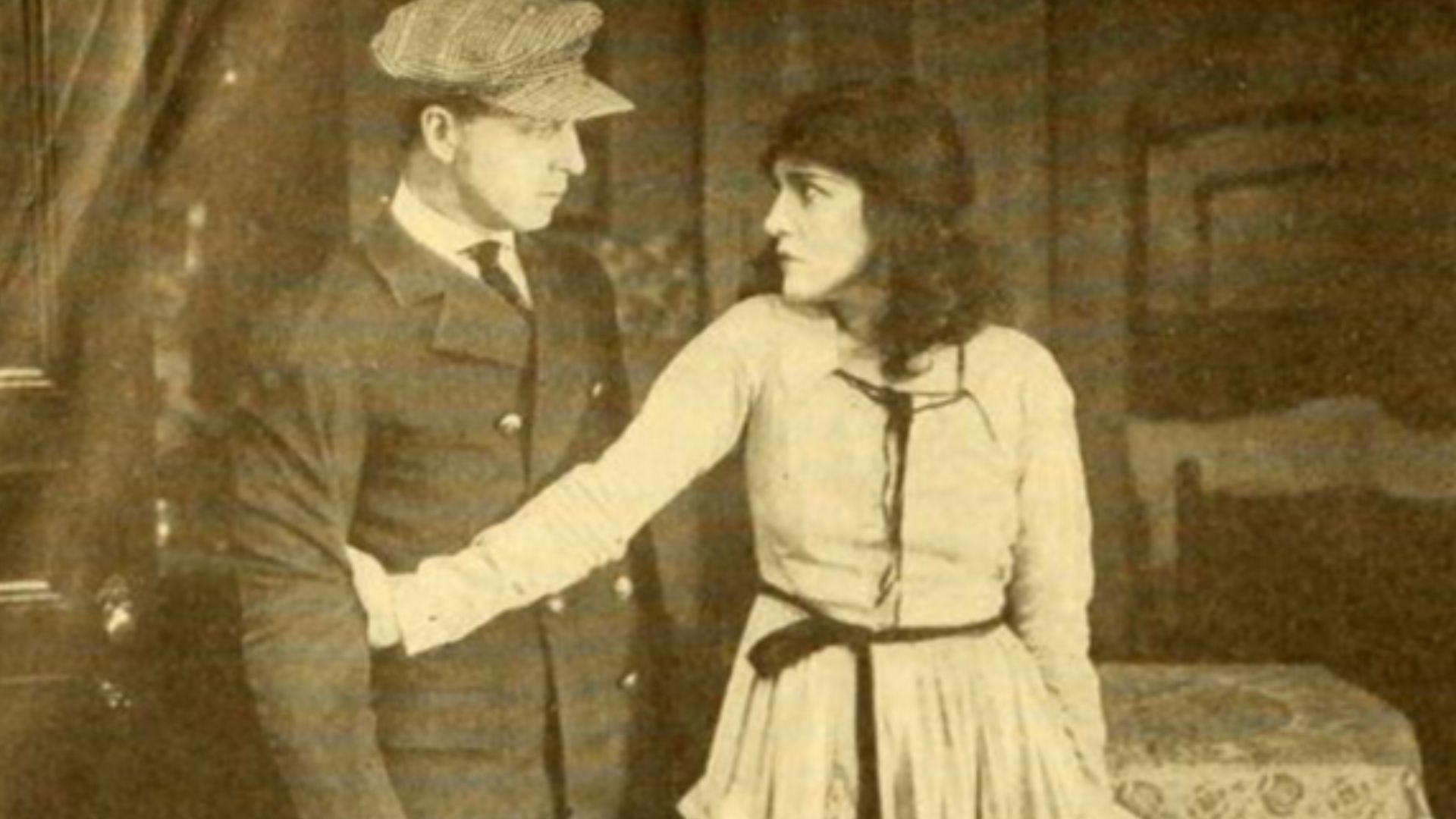 Still from the American film Thou Shalt Not (1919) with Evelyn Nesbit and Gladden James, on page 108 of the April 5, 1919 Moving Picture World.