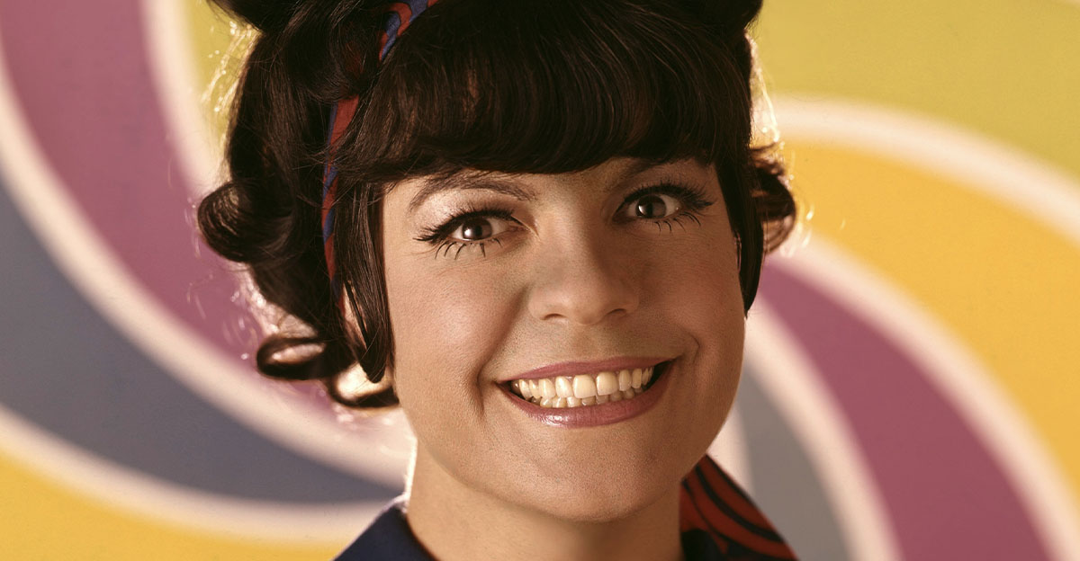 Jo Anne Worley colorful smiling vintage studio pose.