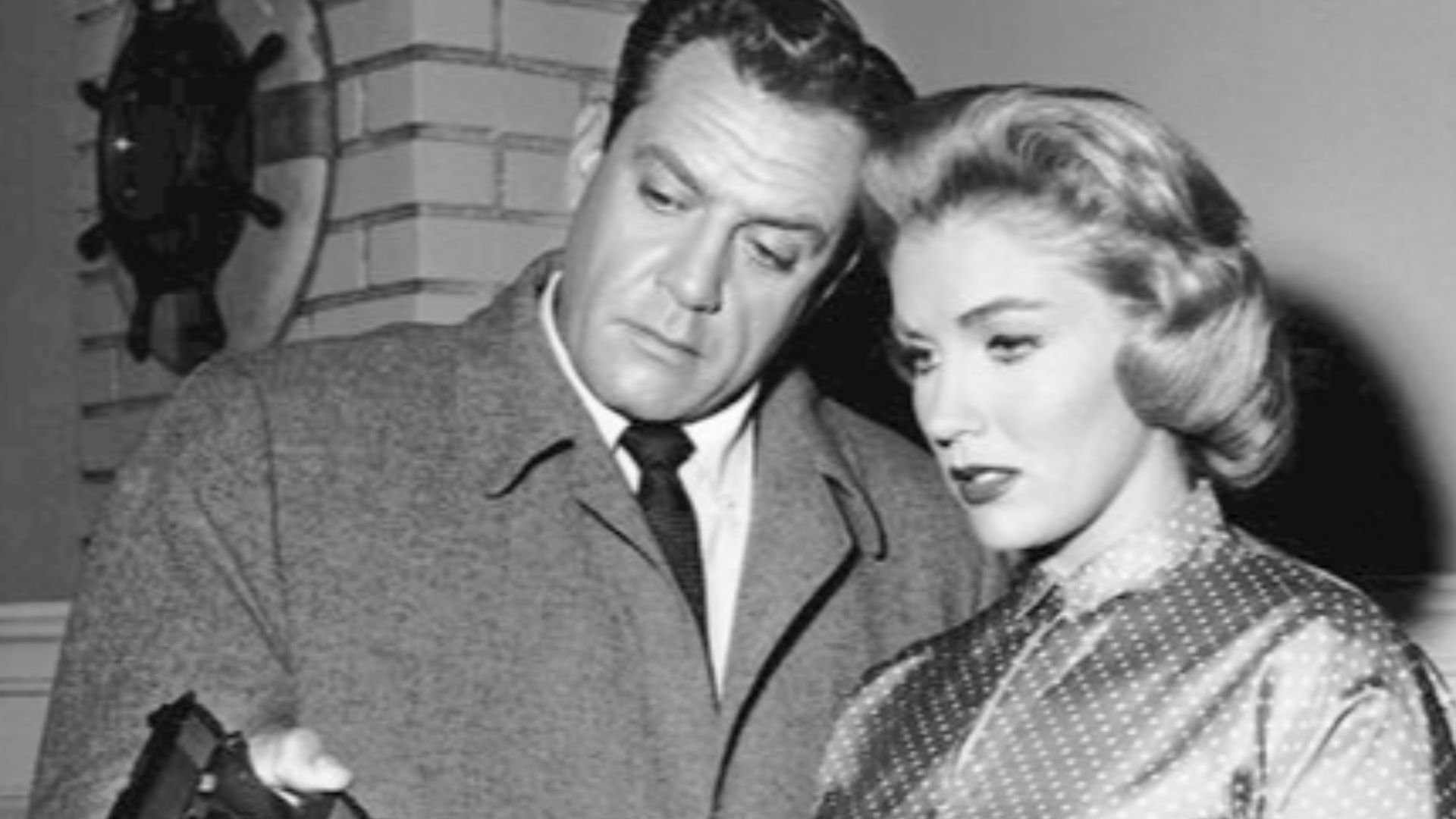 Photo of Raymond Burr as Perry Mason and guest star Joan O'Brien from the television program Perry Mason.