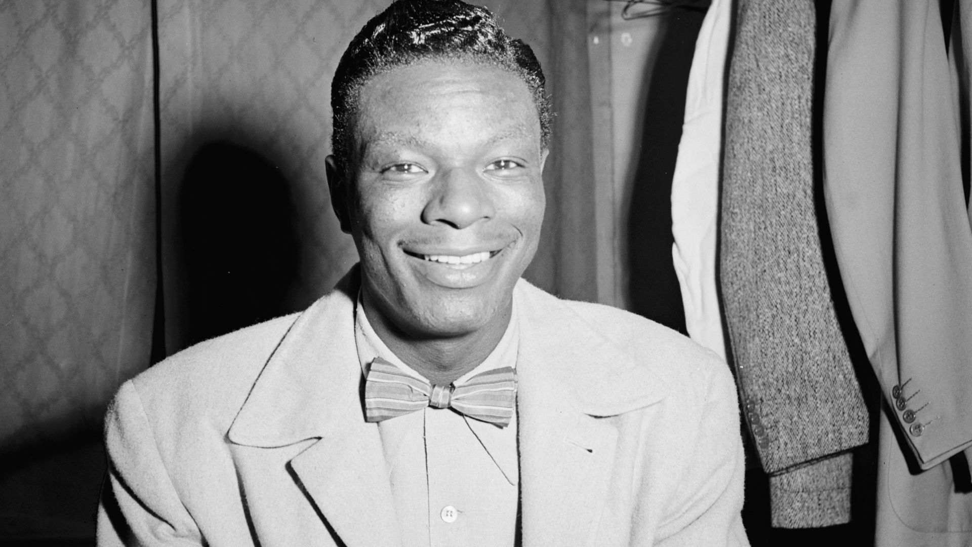Gottlieb, William P., 1917-, photographer.
[Portrait of Nat King Cole, Paramount Theater, New York, N.Y., ca. Nov. 1946]
1 negative :  b&w ; 2 1/4 x 2 1/4 in.
Caption from Down Beat: Jumped push-bike and pedaled to Paramount to corner King Cole & Stan Ken