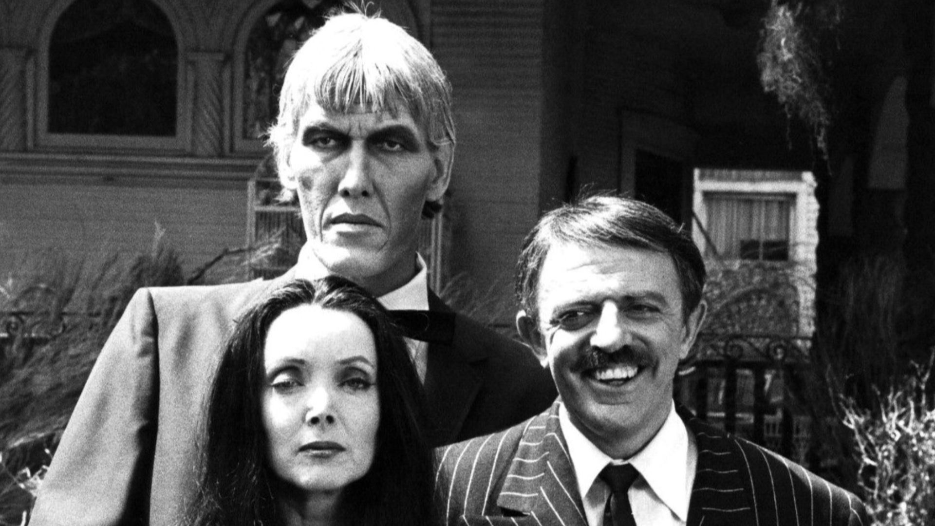 Photo of the main cast of the television program The Addams Family.  From left-Ted Cassidy (Lurch), Carolyn Jones (Morticia) and John Astin (Gomez).  In 1977, NBC reunited the original cast of the series for a Halloween Big Event Special.  This photo is f