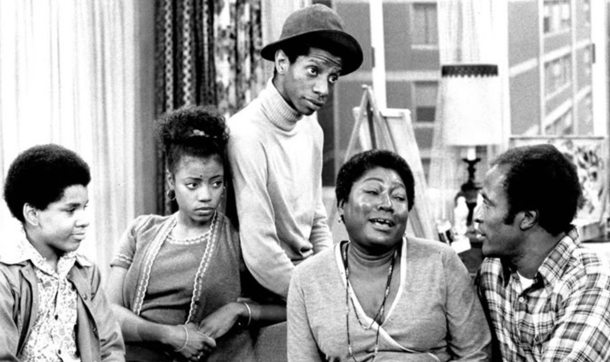 Photo of the Evans family from the television program Good Times.  From left: Ralph Carter (Michael), BernNadette Stanis (Thelma), Jimmie Walker (J.J.), Esther Rolle (Florida), John Amos (James).