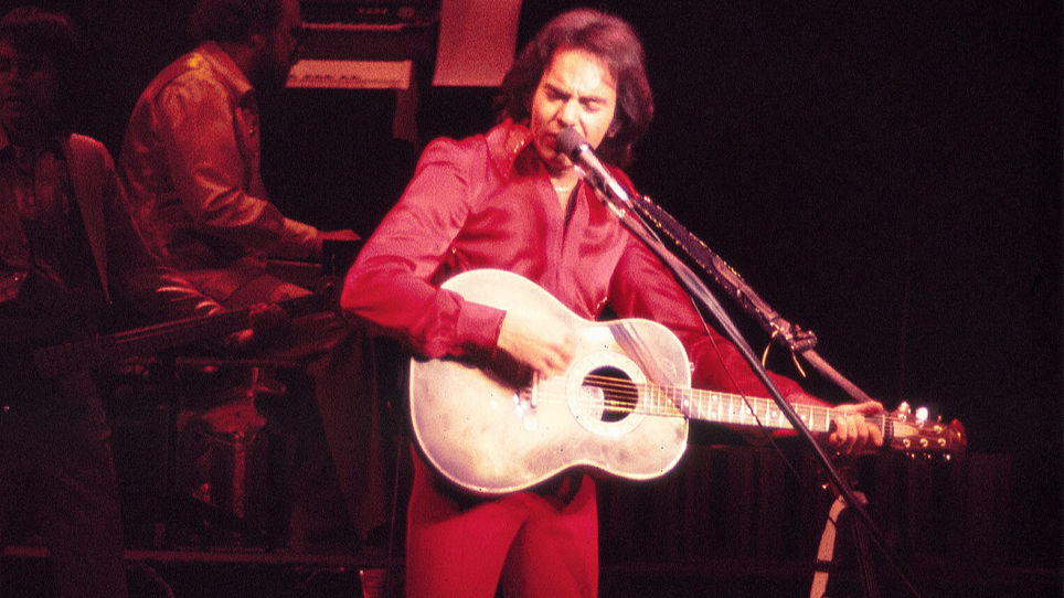 Neil Diamond performing on an opening night of a Theater