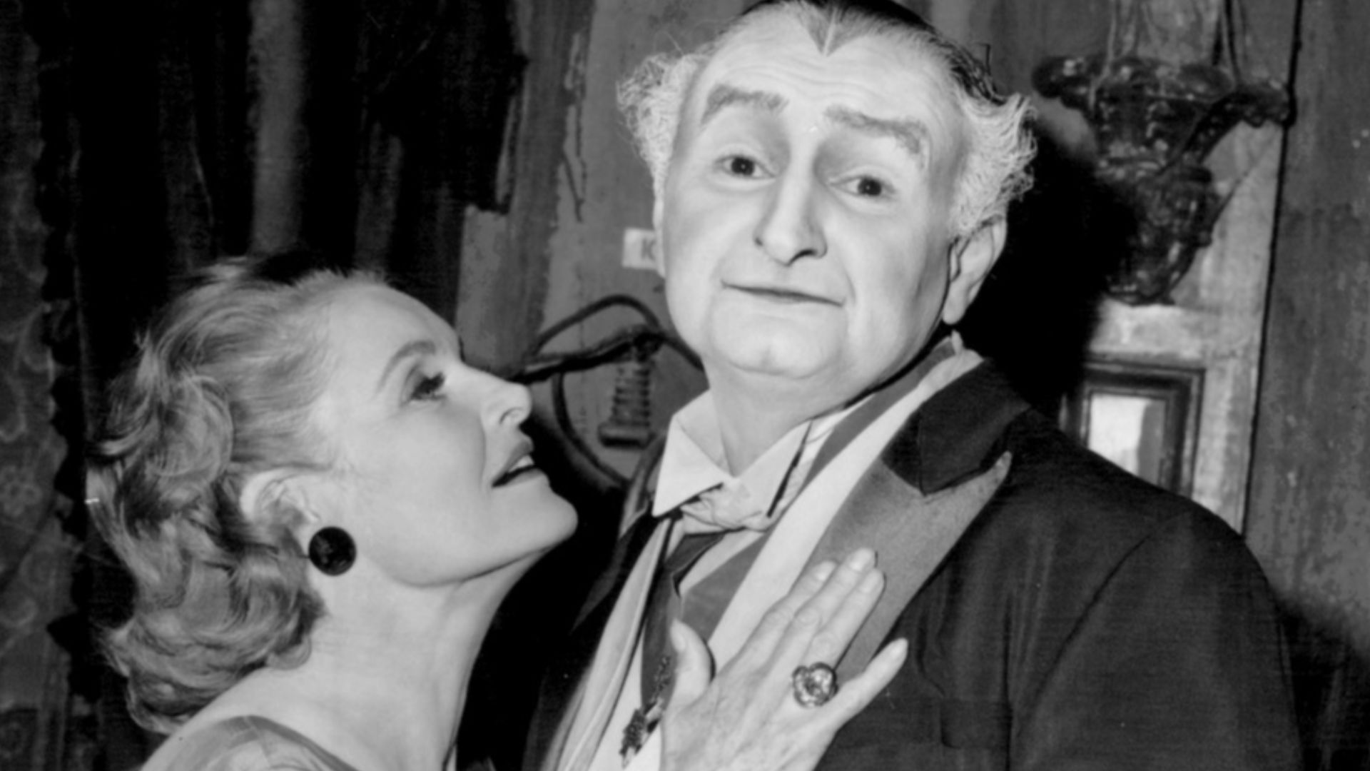 Photo of Al Lewis and Linda Watkins from the television series The Munsters.  Grandpa (Lewis) is lonely so he contacts a matchmaking club.