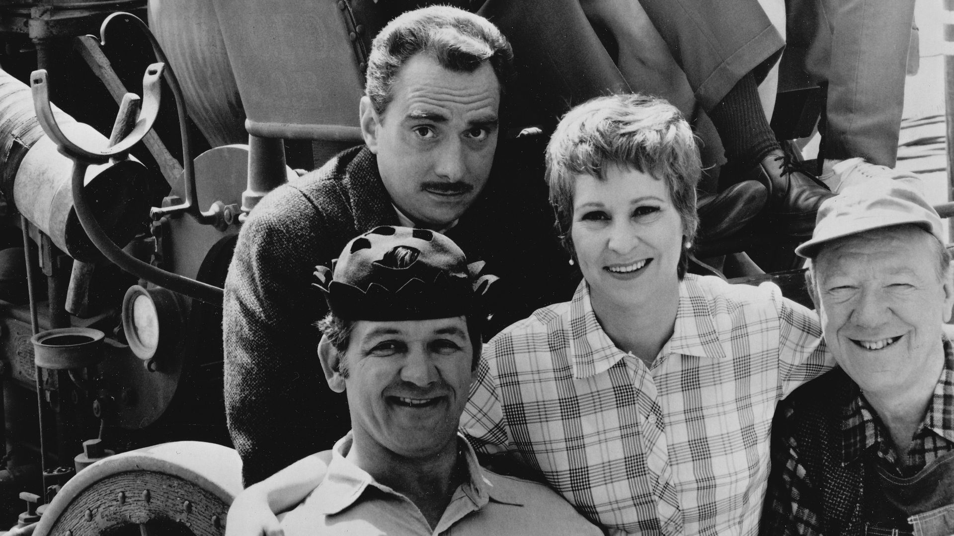 Publicity photo of American actors, (top row; seated in fire engine; L–R) Ken Berry, Arlene Golonka, Buddy Foster, (front row; L–R) George Lindsey (in hat), Jack Dodson, Alice Ghostley and Paul Hartman, promoting the CBS television series Mayberry R.F.D..