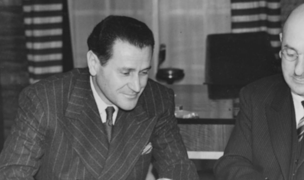Film producer David Rose (left), of Paramount Pictures, signing a contract with Oscar Deutsch of Odeon Cinema's to move control of seven theatres to Odeon, London, November 23rd 1939.