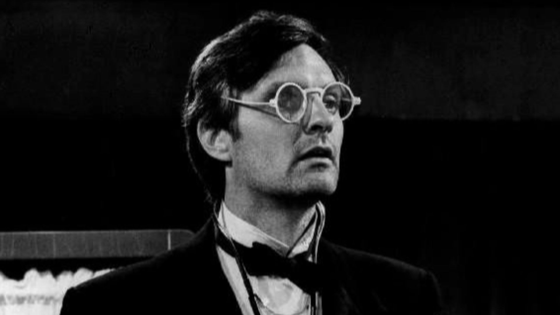 Photo of Alan Alda as Hawkeye from the television program M.A.S.H..  Hawkeye dons black tie for his post-op rounds.