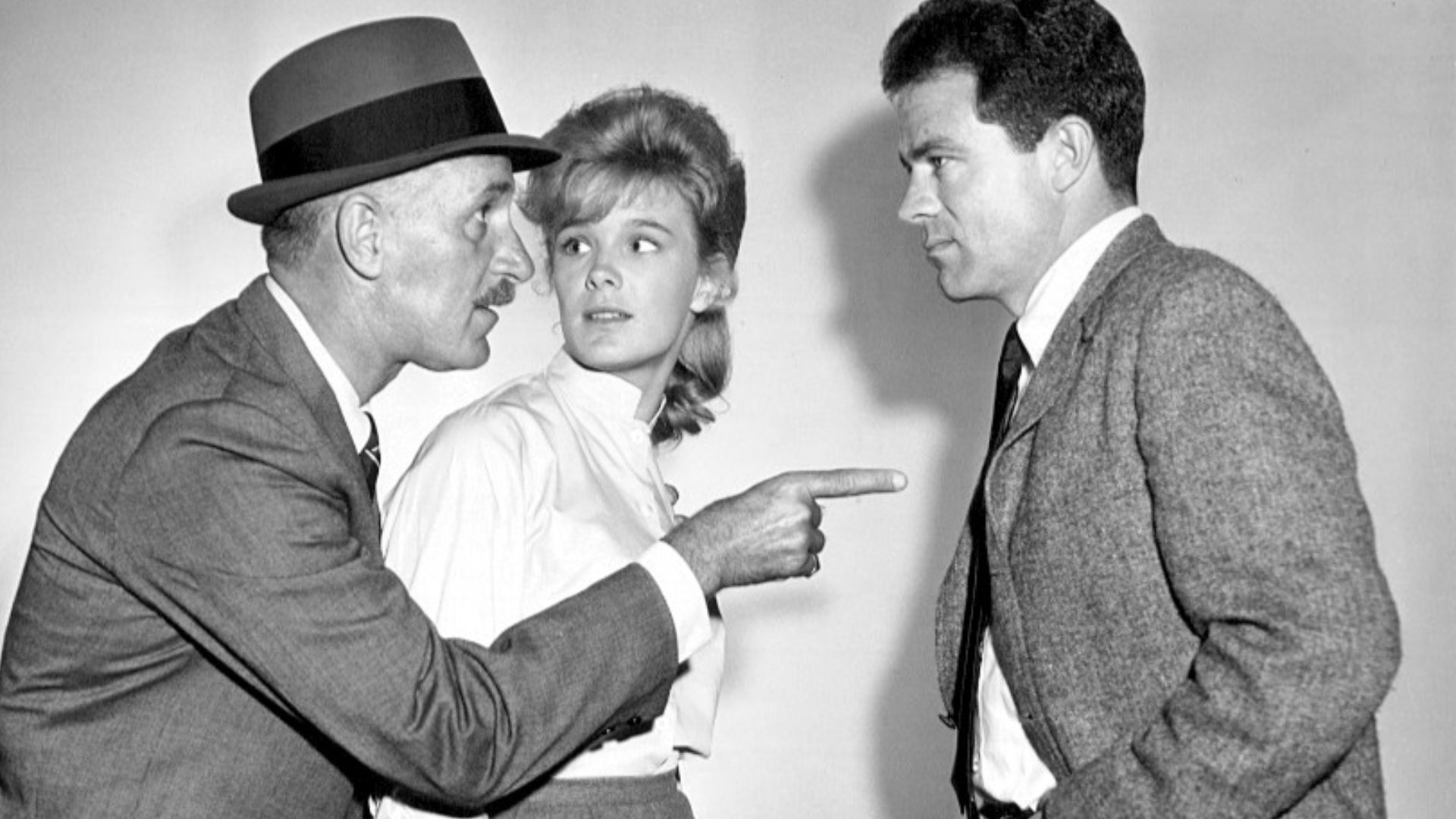 Photo of Keenan Wynn as an angry father who believes Dr. Paul Graham (Jack Ging) is interfering in his family's affairs.  Linda Evans plays Wynn's daughter in the episode.