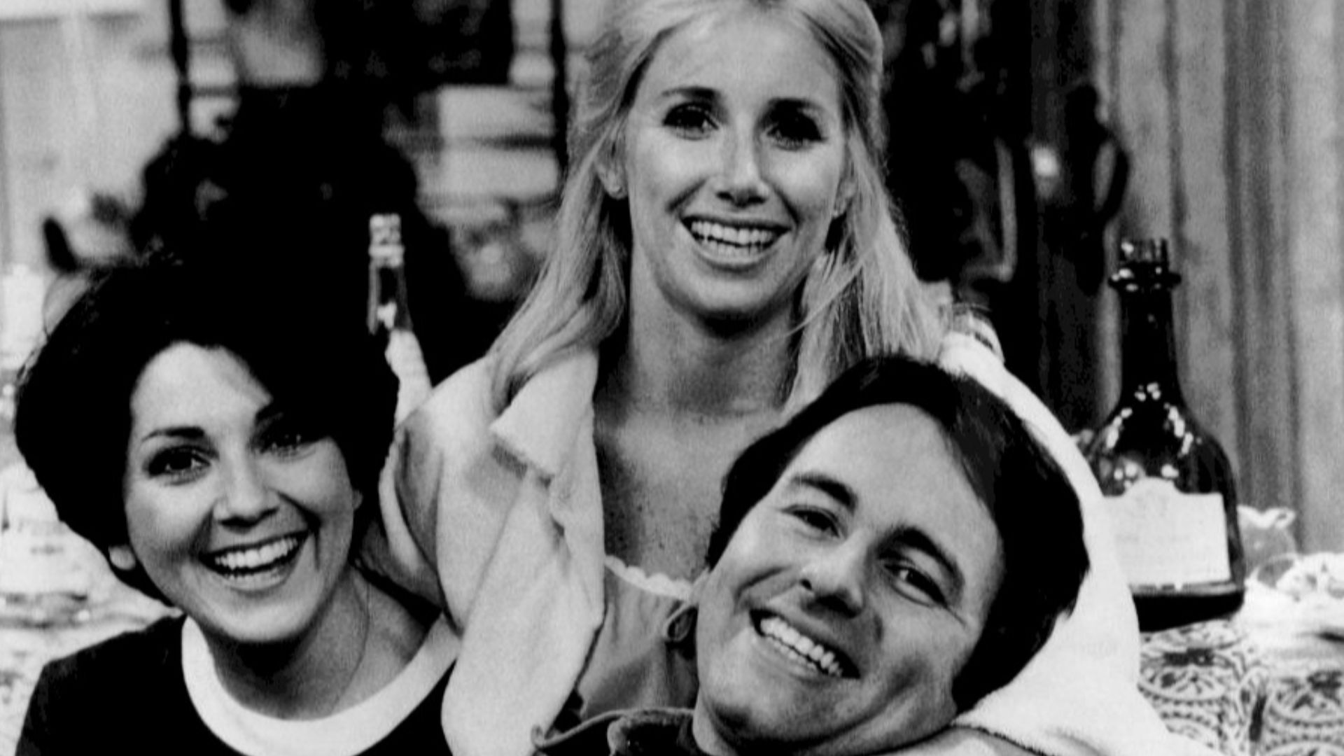 Publicity photo of the roommates from the television program Three's Company.  From left: Joyce DeWitt (Janet}, Suzanne Sommers (Chrissy), John Ritter (Jack).