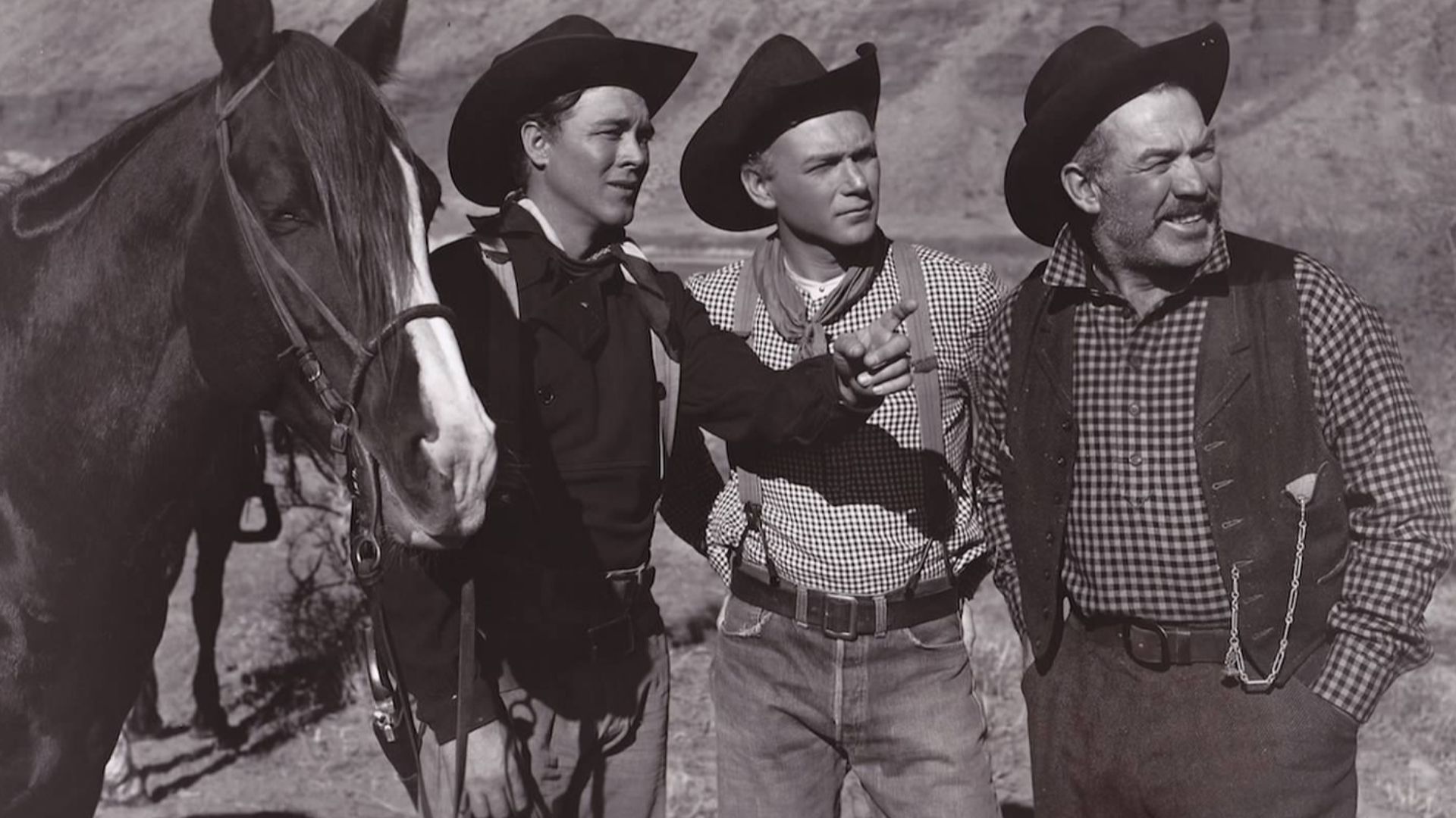 Publicity photo for the film Wagon Master (1950) showing three of its stars. From left to right: Ben Johnson, Harry Carey, Jr., and Ward Bond.