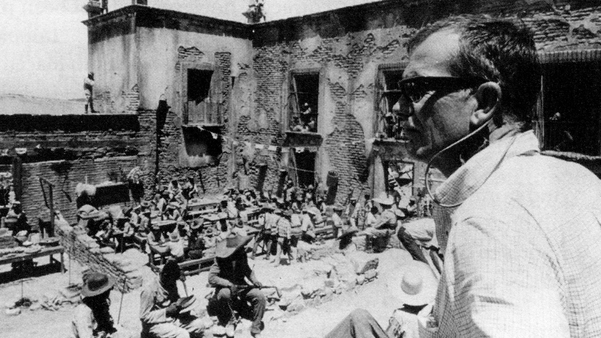 Production still for the film The Wild Bunch. Director Sam Peckinpah on right.