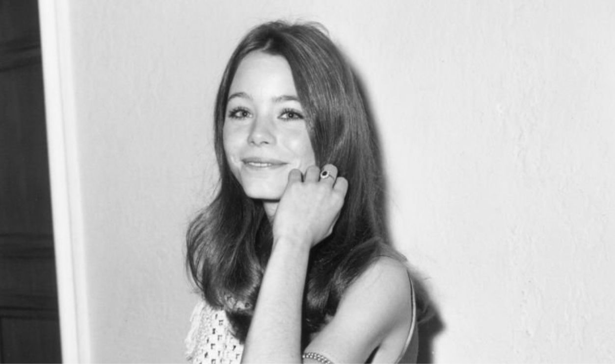 December 1970: American actor Susan Dey touches her hair and smiles while at the annual Golden Apple Awards, hosted by the Hollywood Women's Press Club, Beverly Hills Hotel, Beverly Hills, California, December 1970.