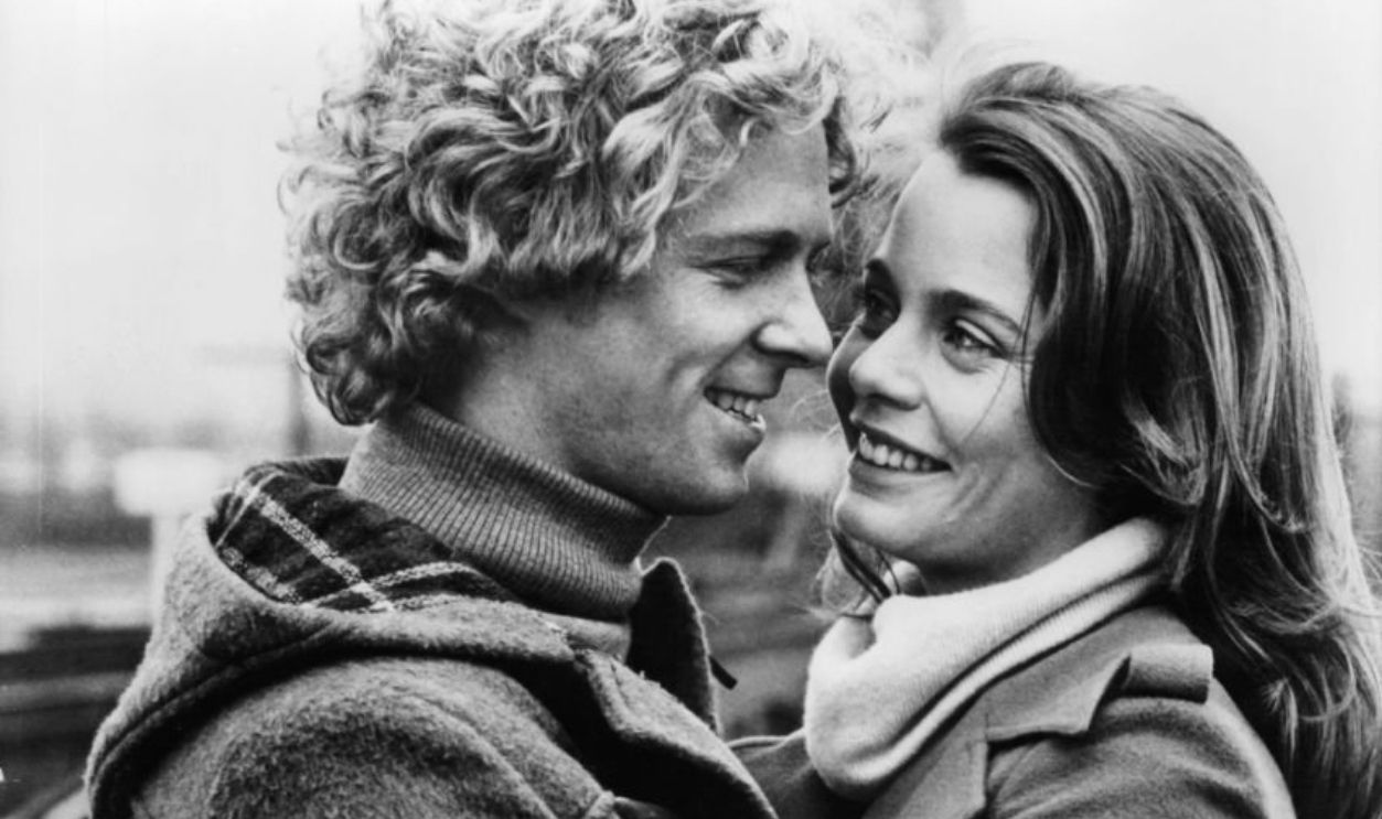 William Katt and Susan Dey holding each other in a scene from the film 'First Love', 1977.