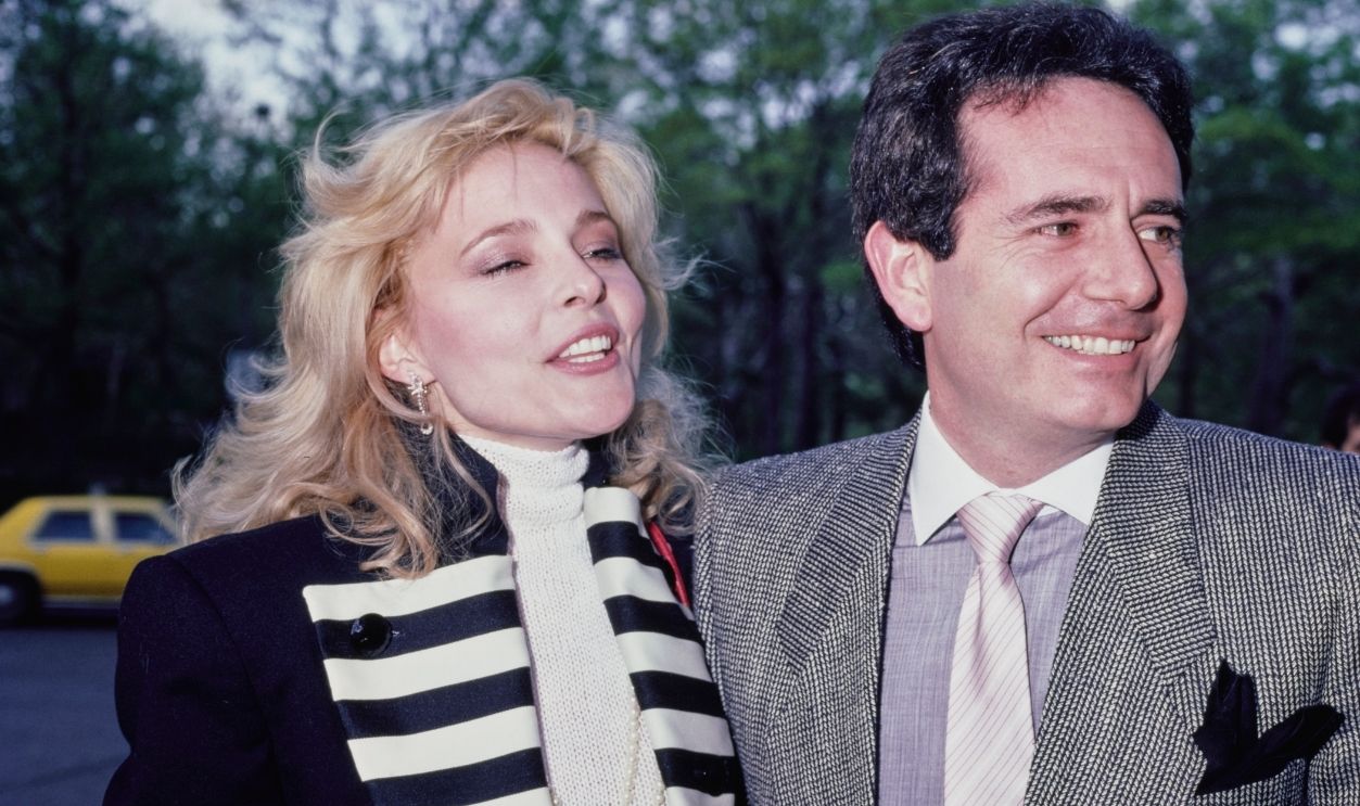 American actress Priscilla Barnes, wearing a black jacket with black-and-white striped lapels, and American actor Richard Kline, wearing a tweed jacket over a grey shirt with a white collar and tie with diagonal stripes, location unspecified, circa 1985. Barnes and Kline co-starred in American sitcom 'Three's Company'.