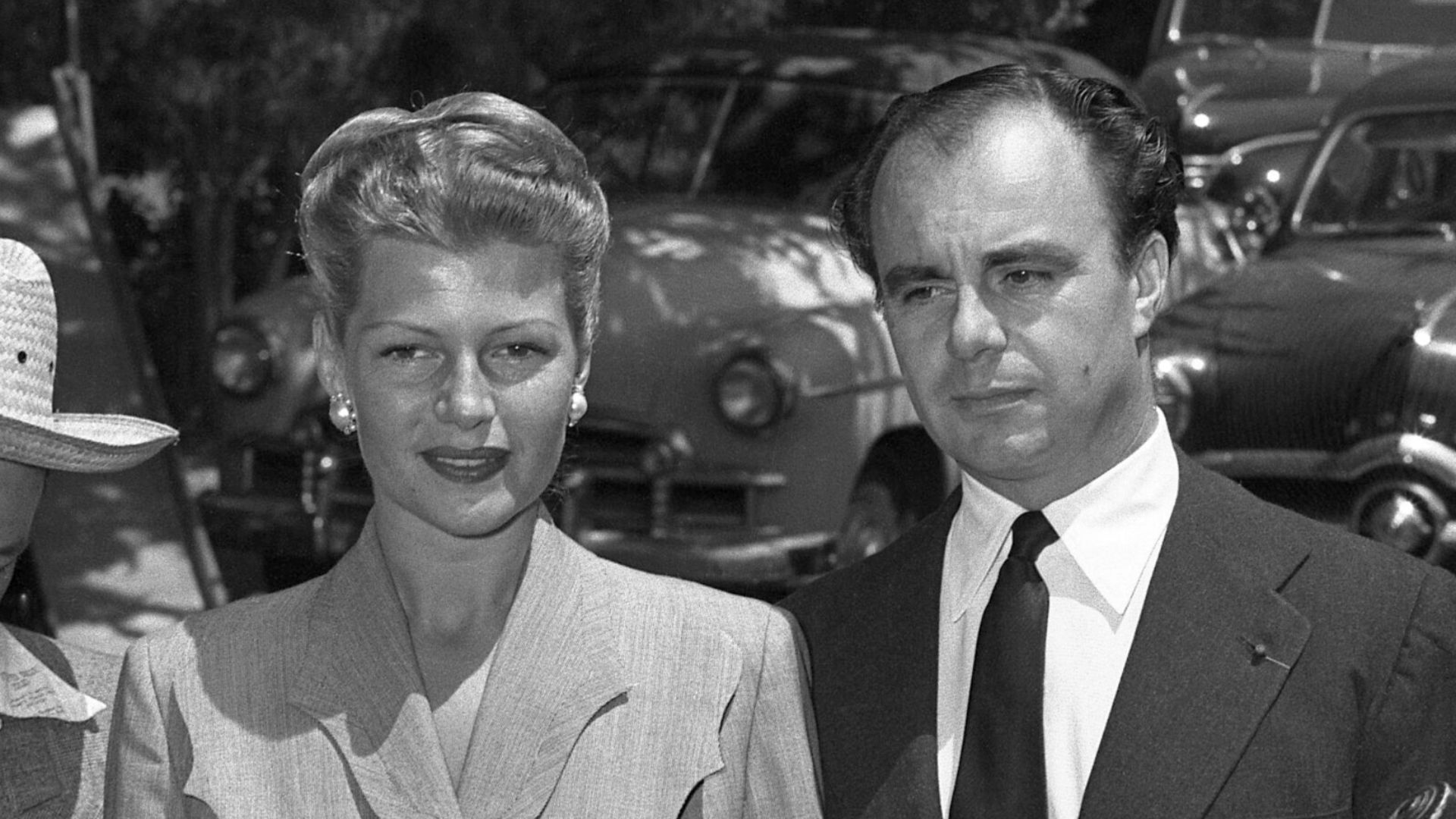 Rita Hayworth and estranged husband Aly Kahn surrounded by reporters outside Hayworth's home