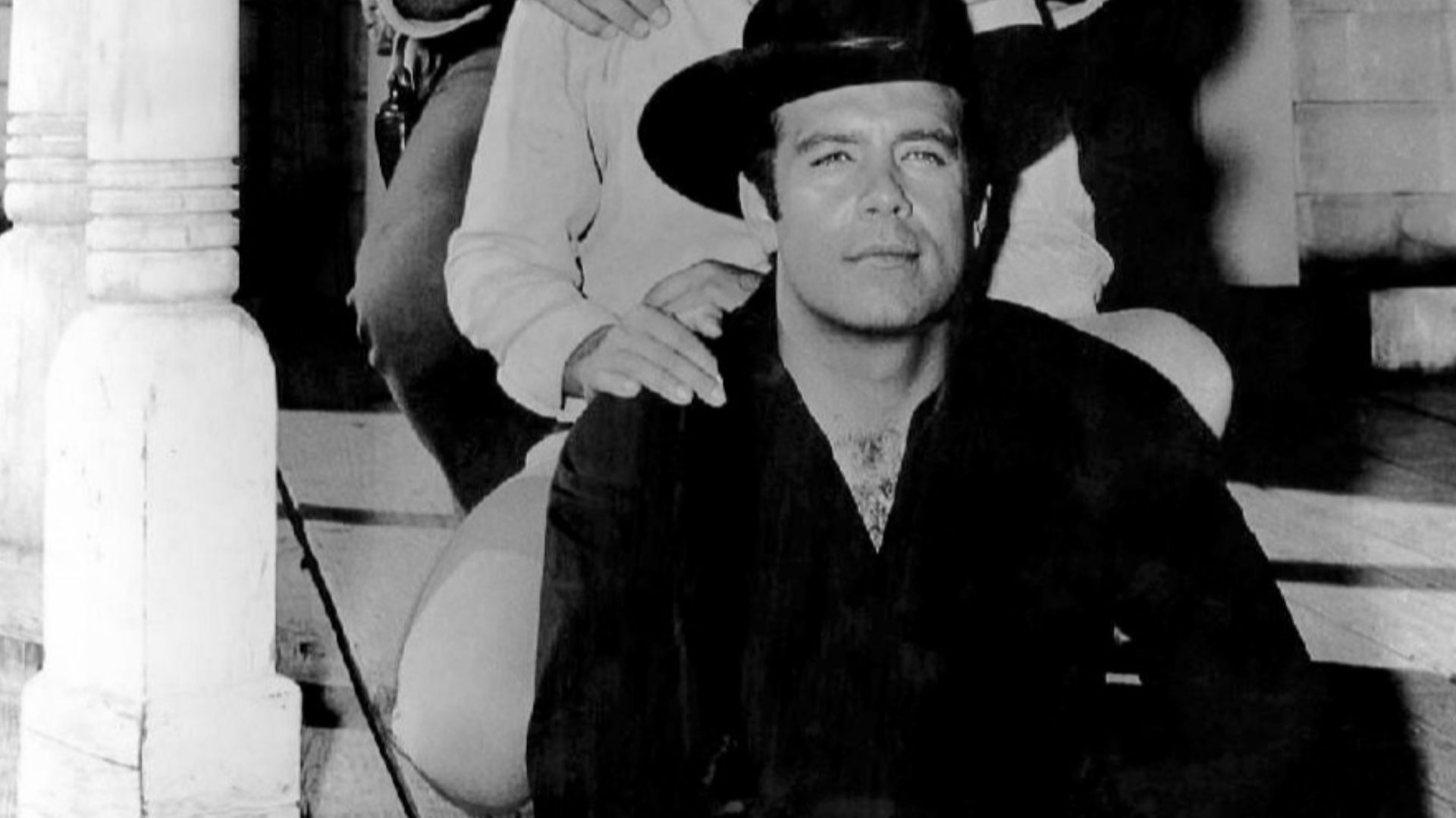 Photo of the full cast of the television program Bonanza on the porch of the Pondarosa from 1962.  From top: Lorne Greene, Dan Blocker, Michael Landon, Pernell Roberts. This episode,