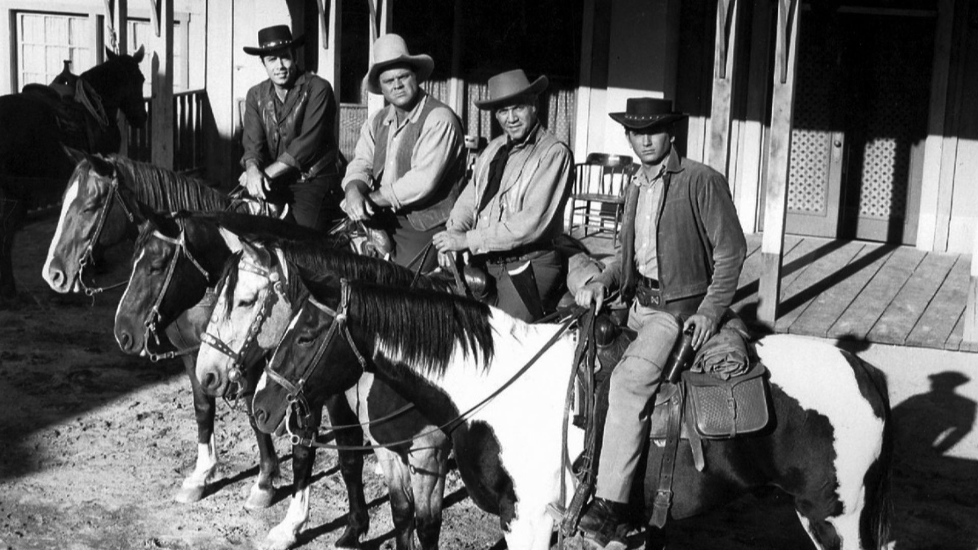 Photo of the main cast of Bonanza.  From left-Pernell Roberts (Adam), Dan Blocker (Hoss), Lorne Greene (Ben), Michael Landon (Little Joe).