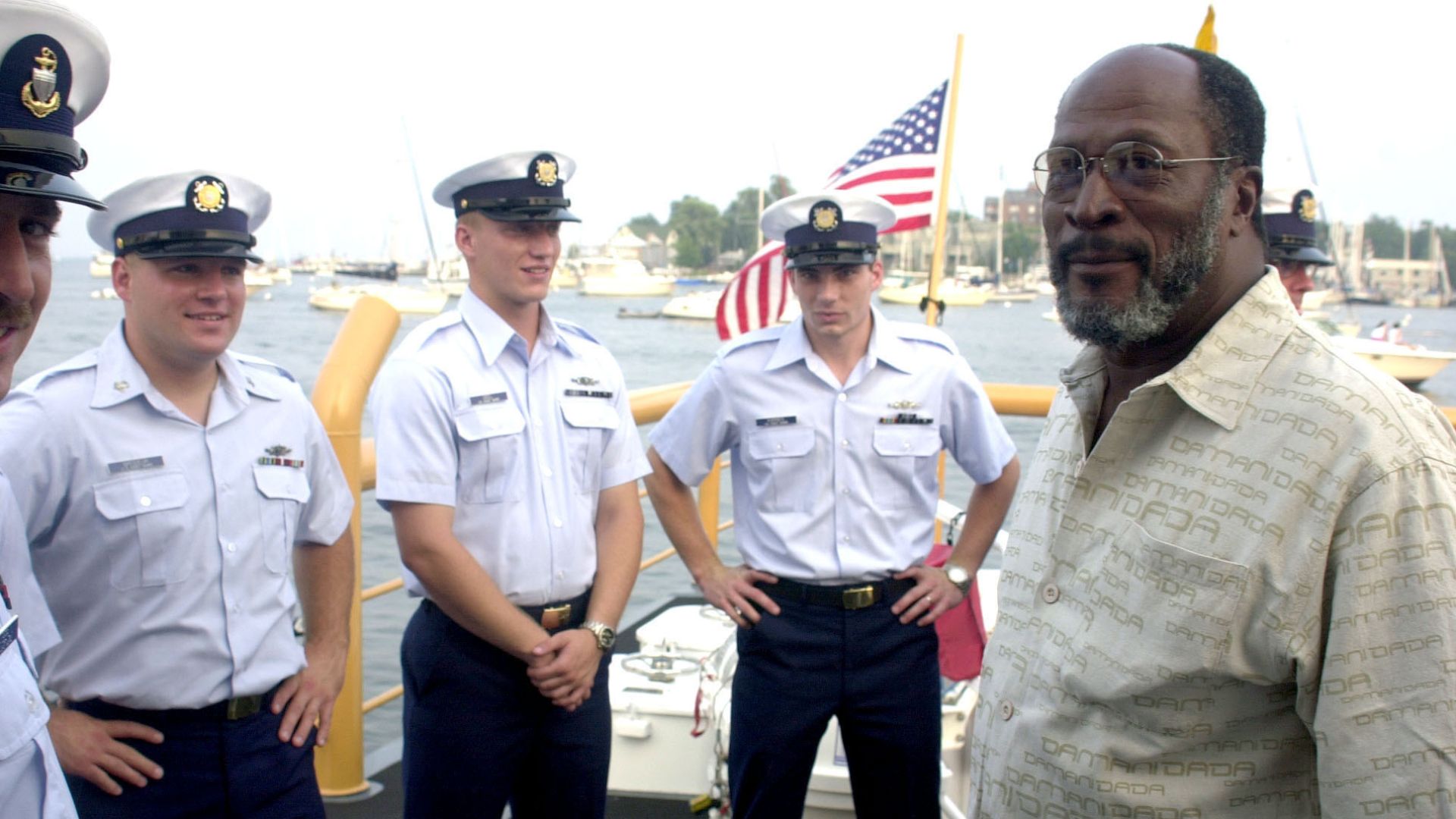 Annapolis, MD (Aug. 8)--John Amos takes a moment to chat with crewmembers of the U.S. Coast Guard Cutter Cochito before the Coast Guard Band concert. Amos is guest narrator at the Coast Guard's 211th year Birthday celebration concert. USCG photo by Telfai