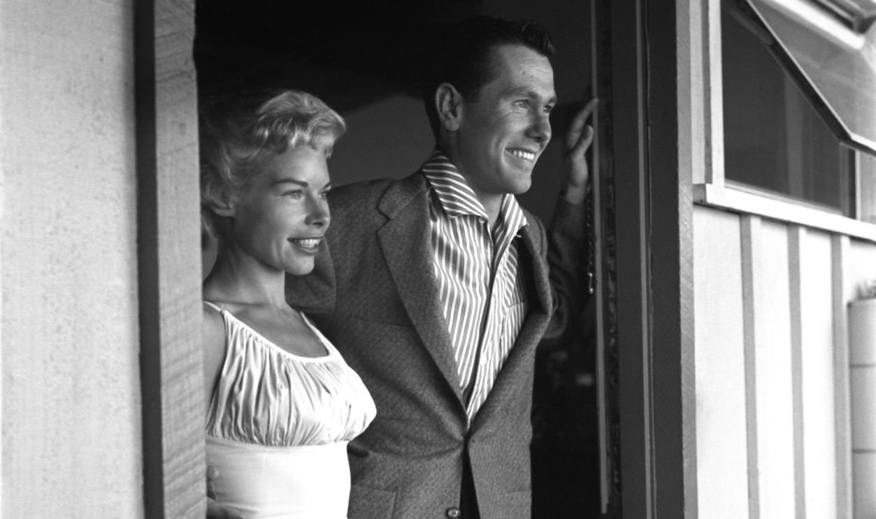  Joan and Johnny Carson host of The Johnny Carson Show on CBS, at home with one of their three sons on July 5, 1956 in Los Angeles, California
