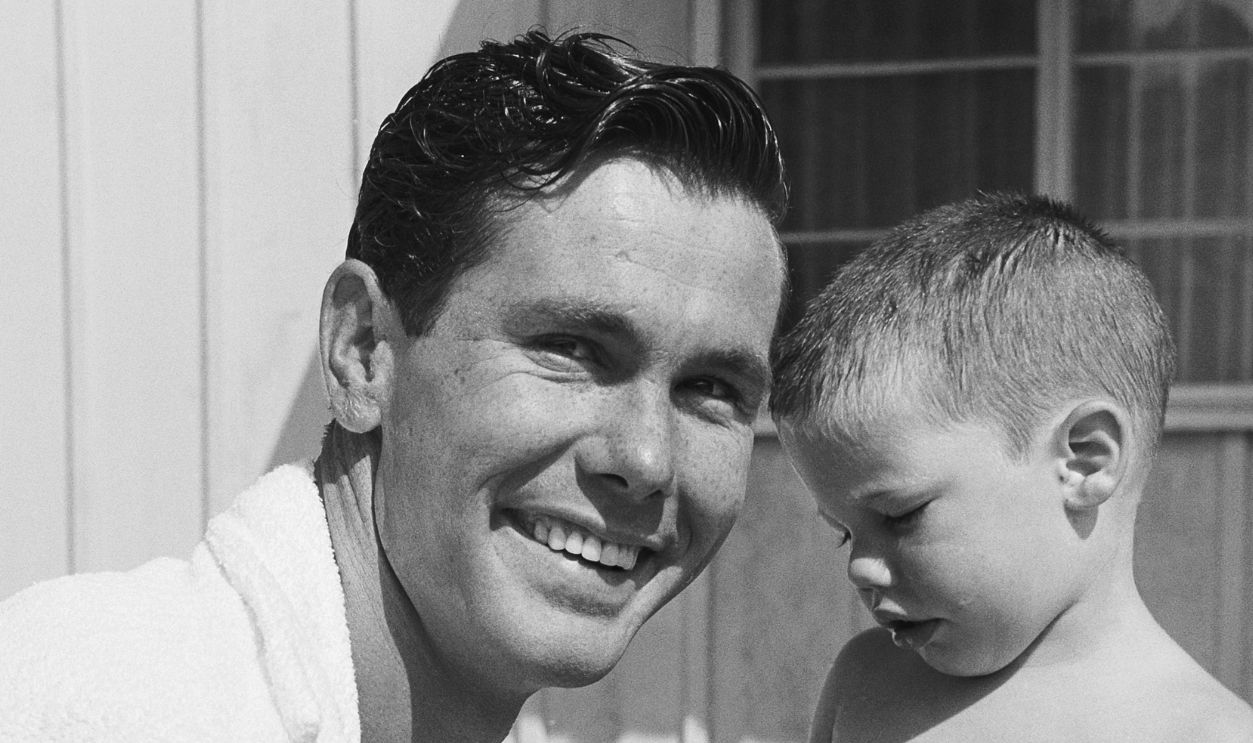 Johnny Carson host of The Johnny Carson Show on CBS, and son Cory play their pool on July 5, 1956 in Los Angeles, California. 