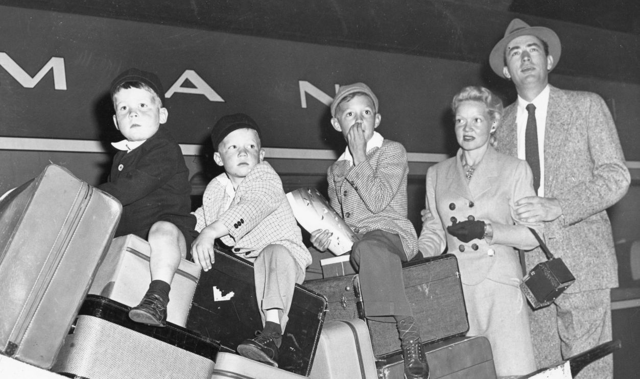Gregory Peck and his wife Greta, and their children Carey Paul, Stephen, and Jonathan are shown at Grand Central station on their arrival today. They are on their way to Rome where Peck will film 'Roman Holiday.'