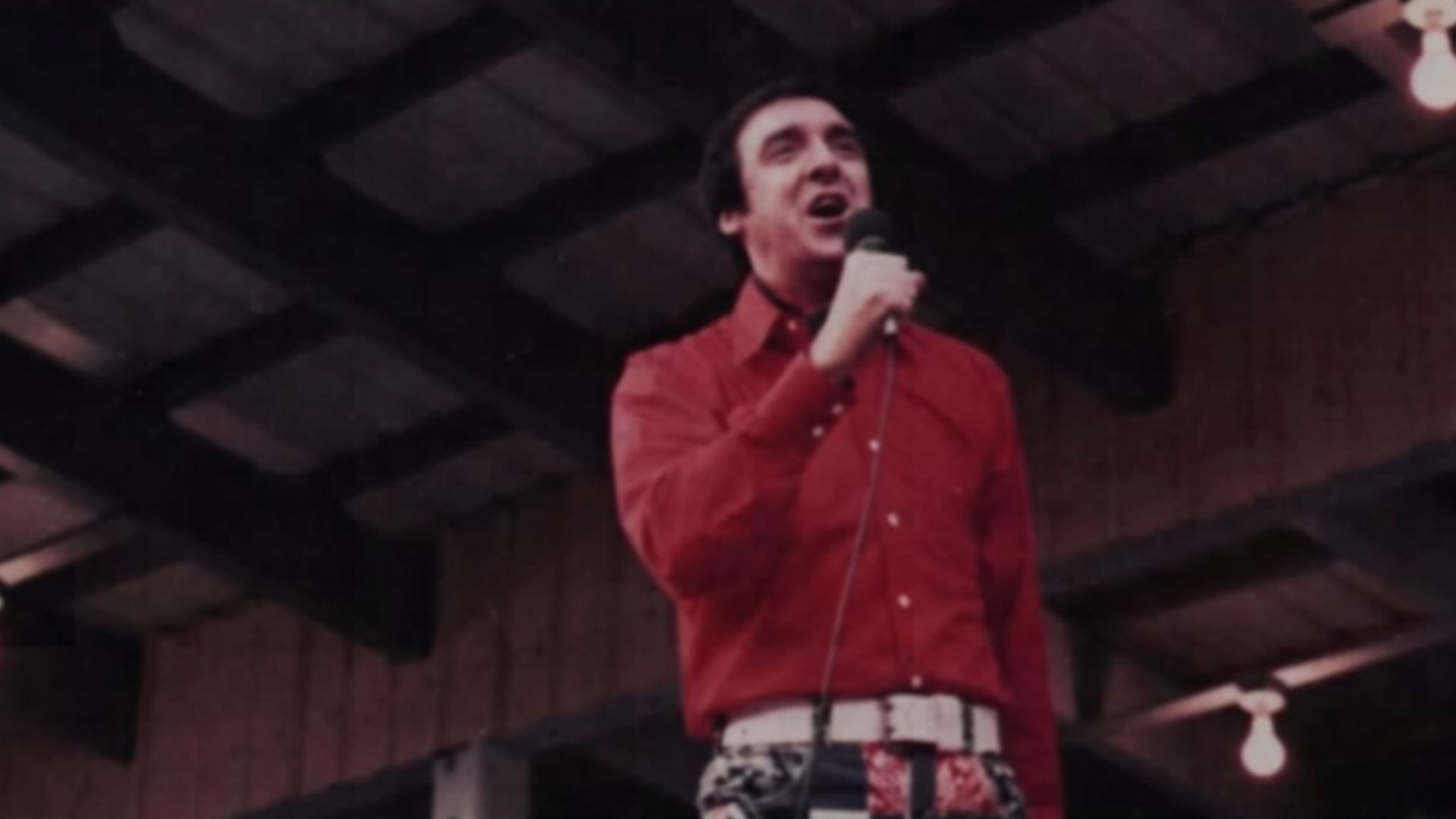Jim Nabors performs at the Curry Ampitheatre, Long Binh, during Bop Hope Christmas Show. NARA 111-CCV-214-CC80343