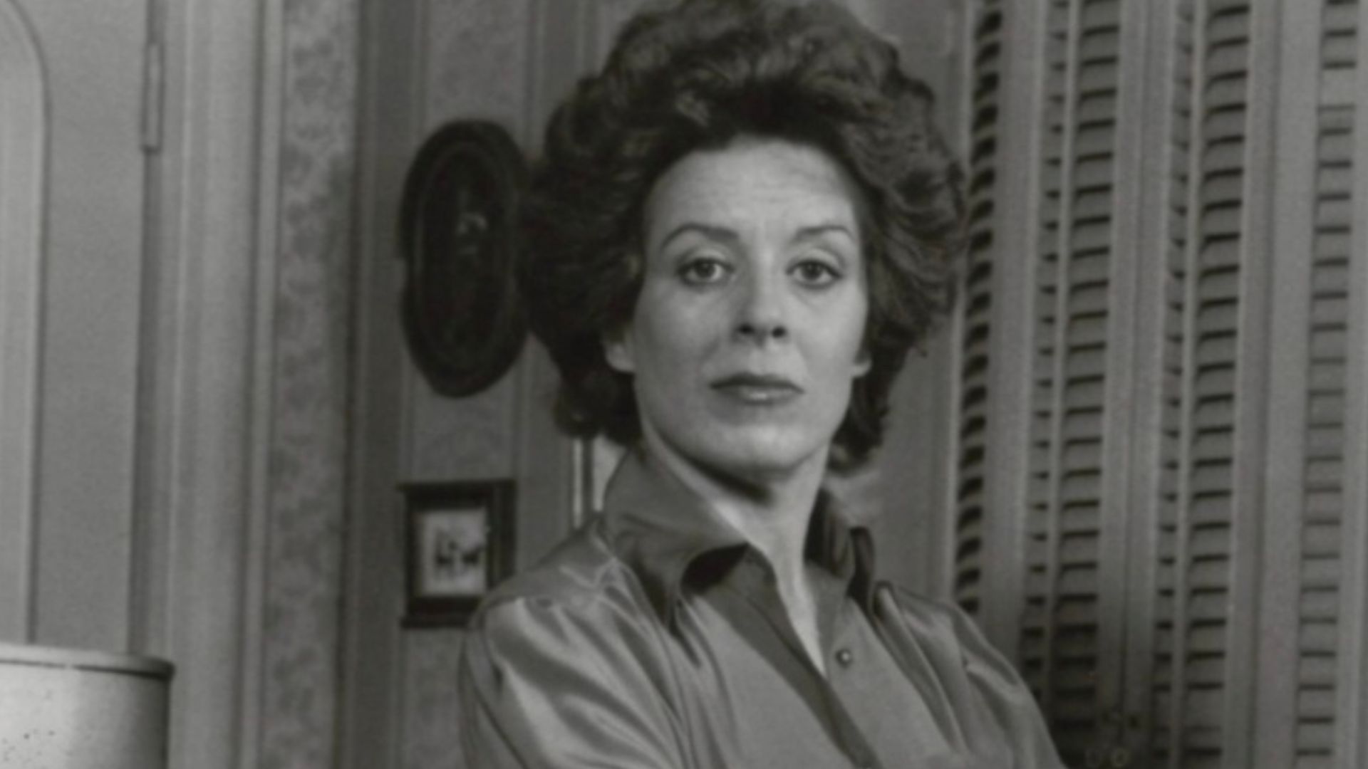 Denise Cavanaugh, played by Holland Taylor (standing) is a woman with a mission: to keep her husband, Miles (Joel Crothers), and the beautiful Nicole Drake (Jayne Bentzen) apart. She's willing to go to any extreme to achieve her goal in the ABC Television