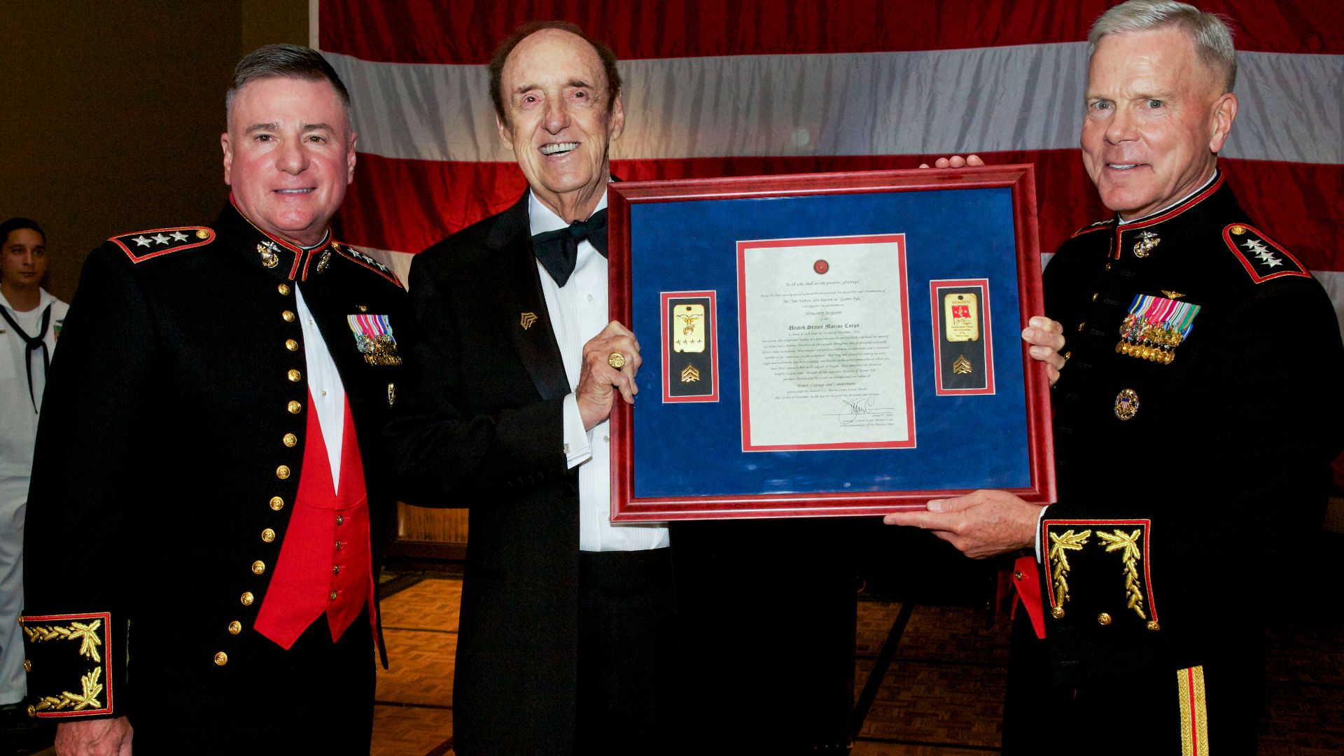 The 35th Commandant of the Marine Corps, Gen. James F. Amos, right, and the Commander of U.S. Marine Corps Forces Pacific (MARFORPAC), Lt. Gen. Terry G. Robling, left, pose for a photo with actor and singer Jim Nabors after promoting him to the honorary r