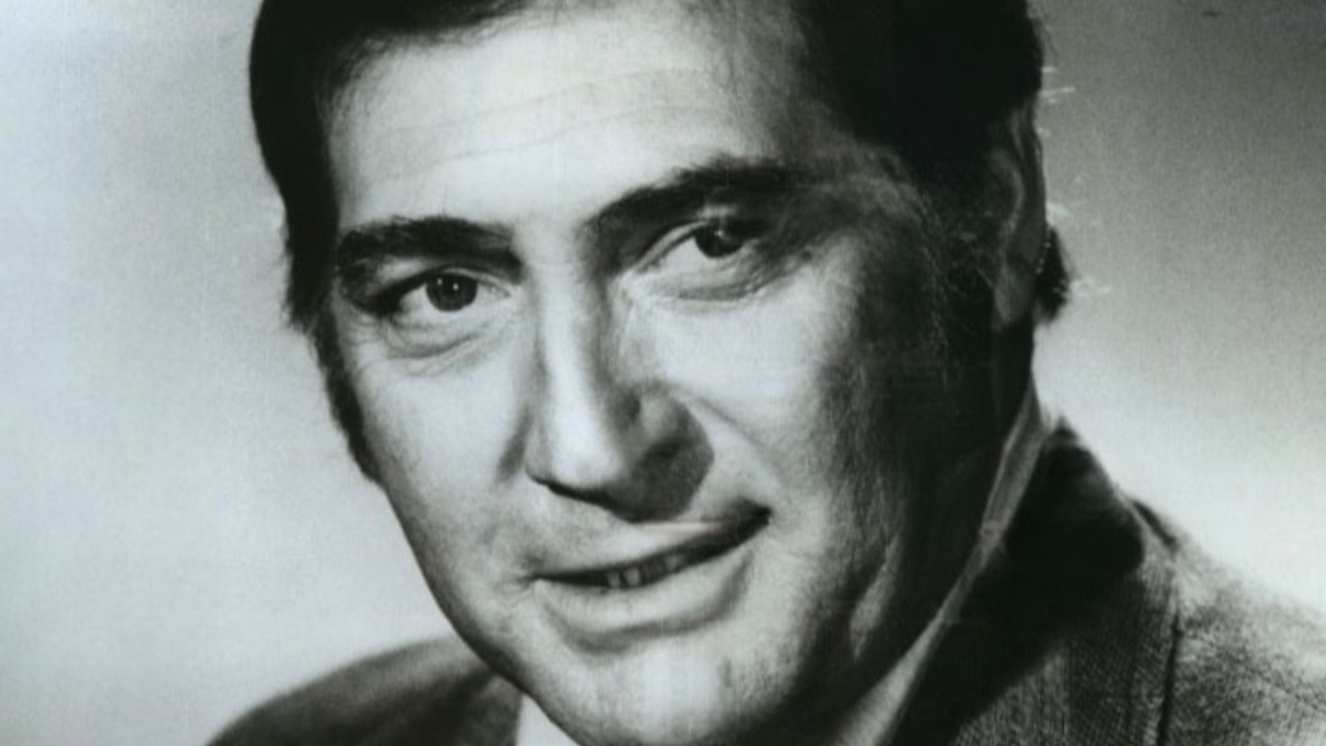 This is a publicity photo, circulated for publicity, of Norman Alden, published in 1976 without copyright notice, qualifying it under public domain.