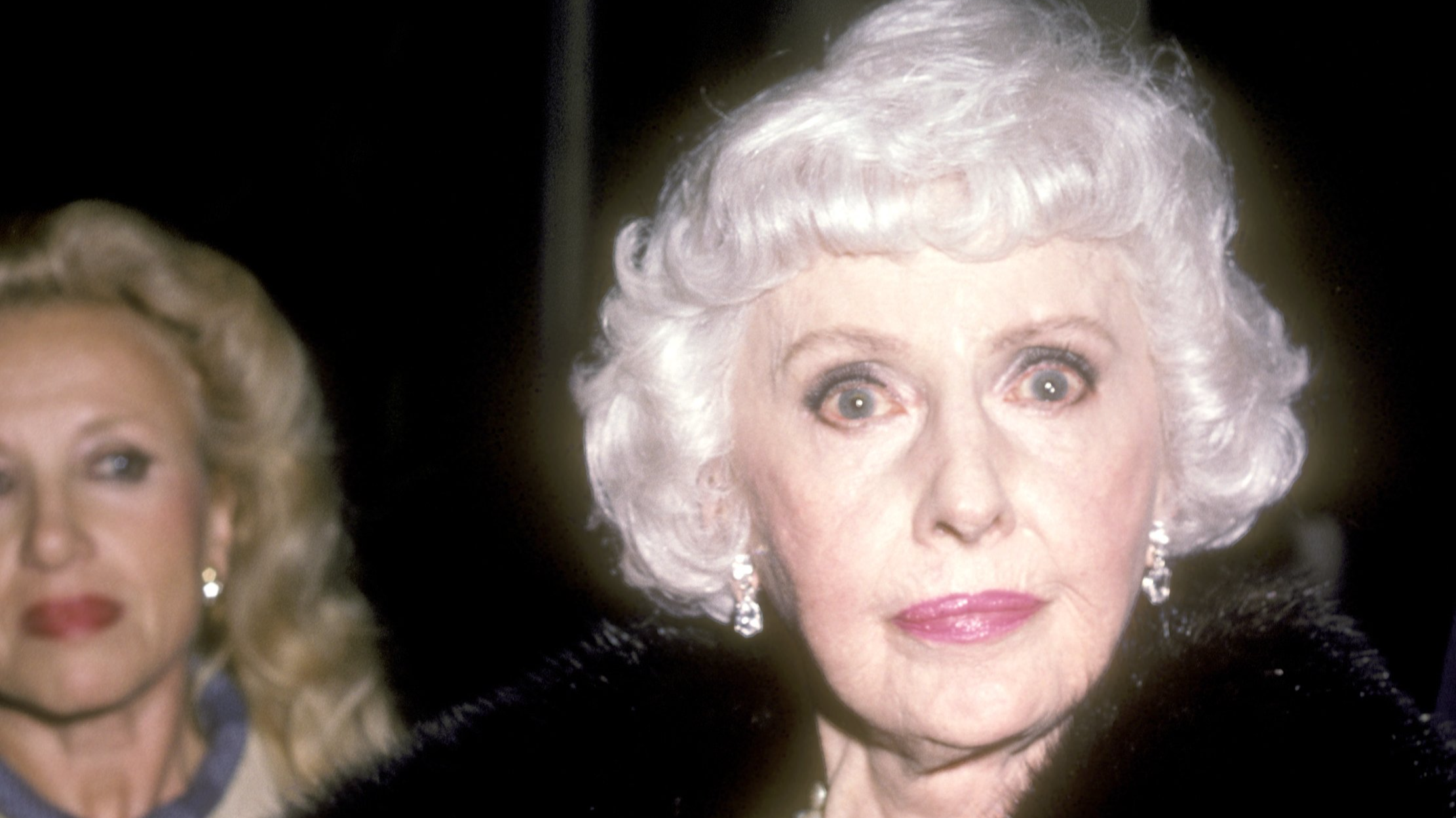 Actress Barbara Stanwyck attends the Party for the Cast of Dynasty on October 25, 1985 at Beverly Wilshire Hotel in Beverly Hills, California in coat and jewelry