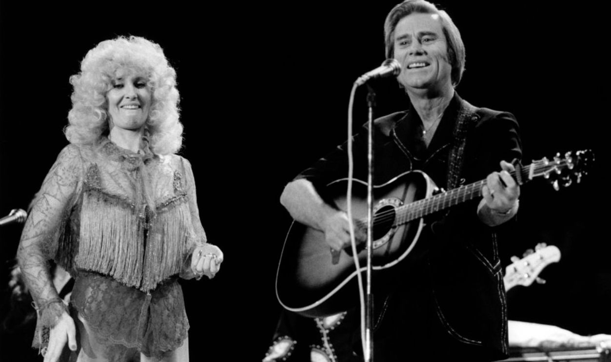 LONDON, 1st APRIL: Country Artists Tammy Wynette (1942-1998)and George Jones perform live on stage at the Country Music Festival, Wembley Arena, London in April 1981.