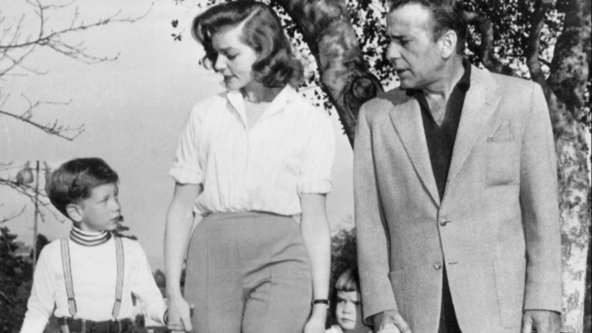 Photo of Humphrey Bogart and his family in April 1956. From left: son Stephen, wife Lauren Bacall, daughter Leslie and Bogart.