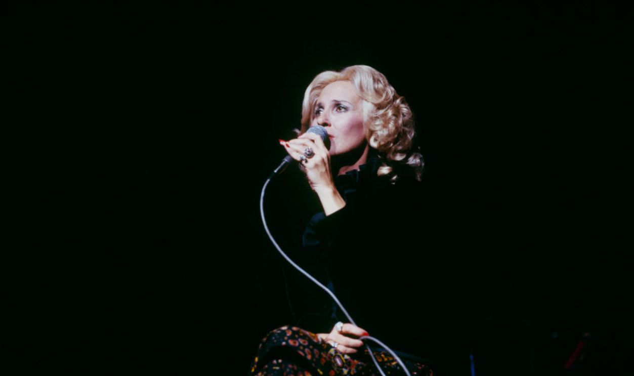 LONDON, UNITED KINGDOM - APRIL 01: Tammy Wynette performs on stage at the Country Music Festival held at Wembley Arena, London in April 1978.