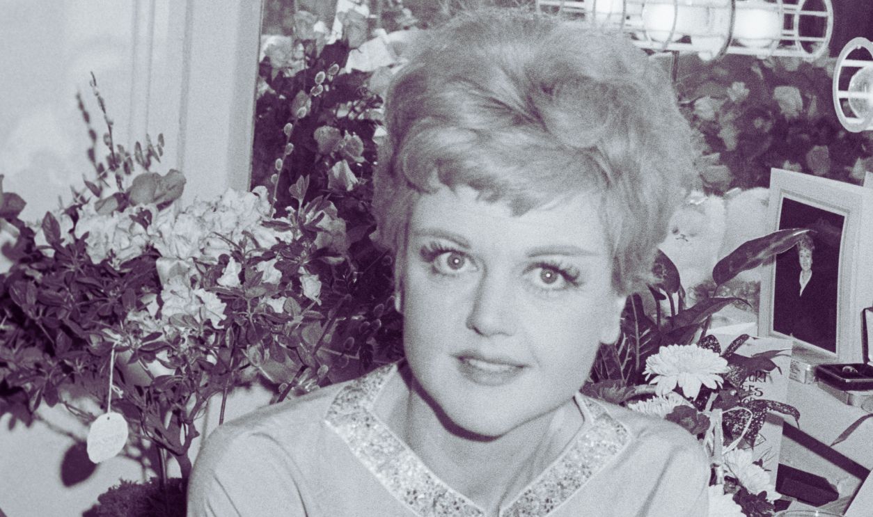 Angela Lansbury seated at her theater dressing table; circa 1970; New York.